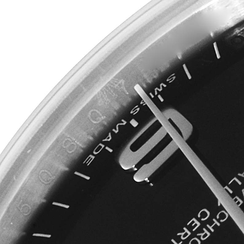 The image shows a close-up of the dial and part of the bezel of a Mid-Size Rolex watch.