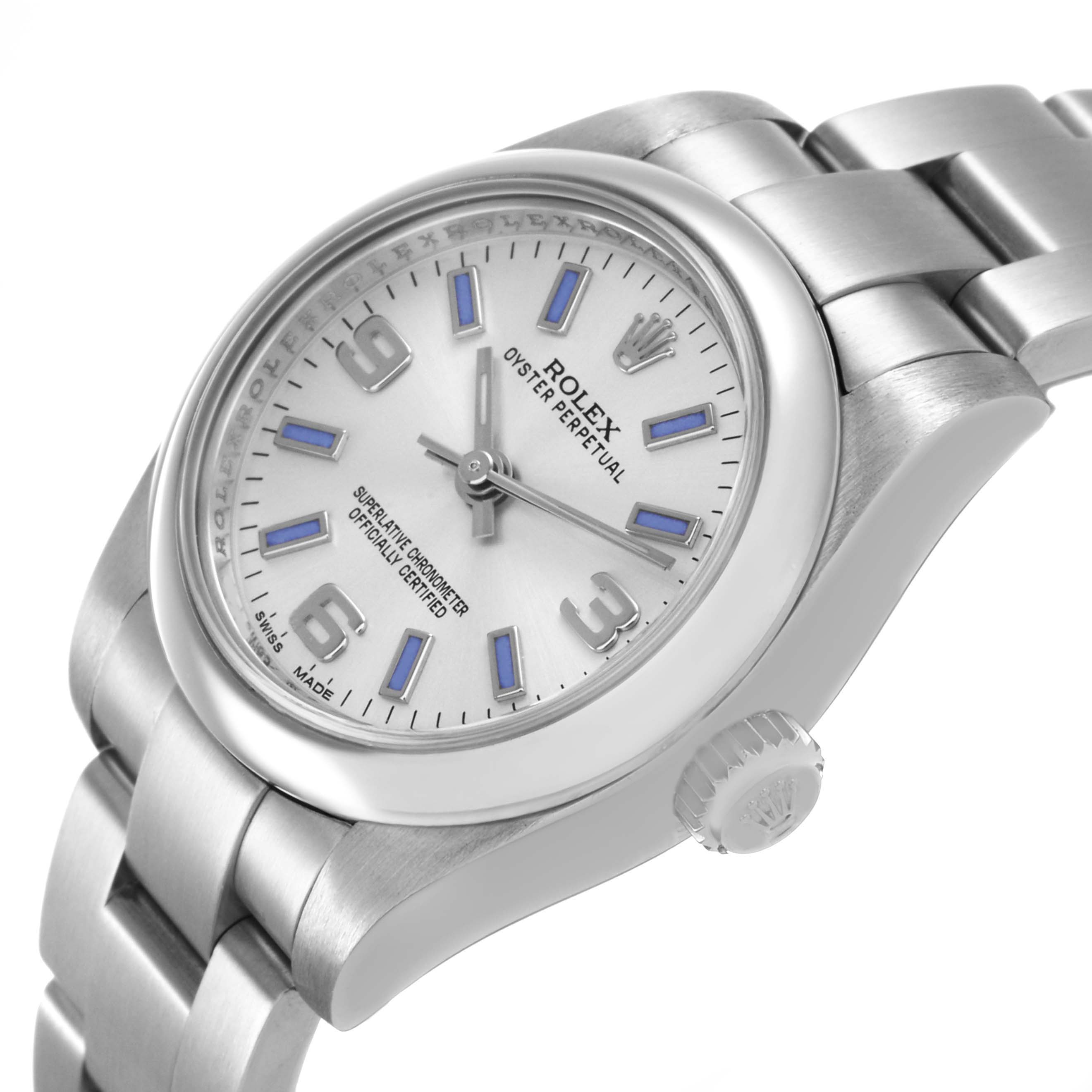 The Rolex Oyster Perpetual 176200 Women's Stainless Steel Silver Dial watch is shown at an angled side view, highlighting the face, bezel, crown, and part of the bracelet.