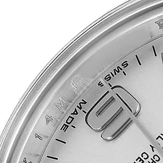 The image shows a close-up of the dial corner of a Rolex Oyster Perpetual 176200 Women's Stainless Steel Silver Dial, highlighting the hands and "Swiss Made" text at the bottom.
