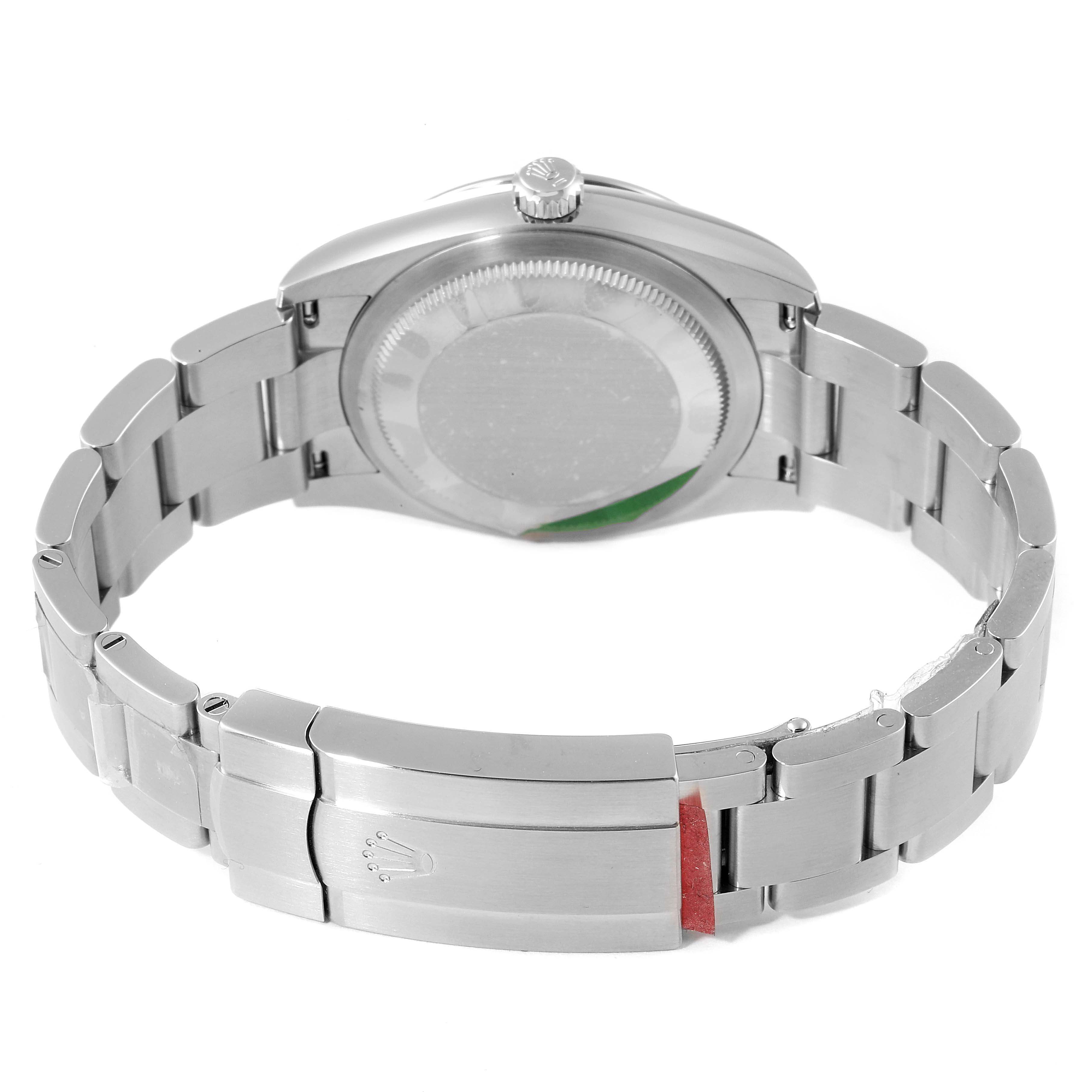 The image shows the back view of a Rolex Oyster Perpetual 124200 Men
s Stainless Steel Pink Dial 124200 Men
s Stainless Steel Pink Dial watch, highlighting its case back and bracelet clasp.