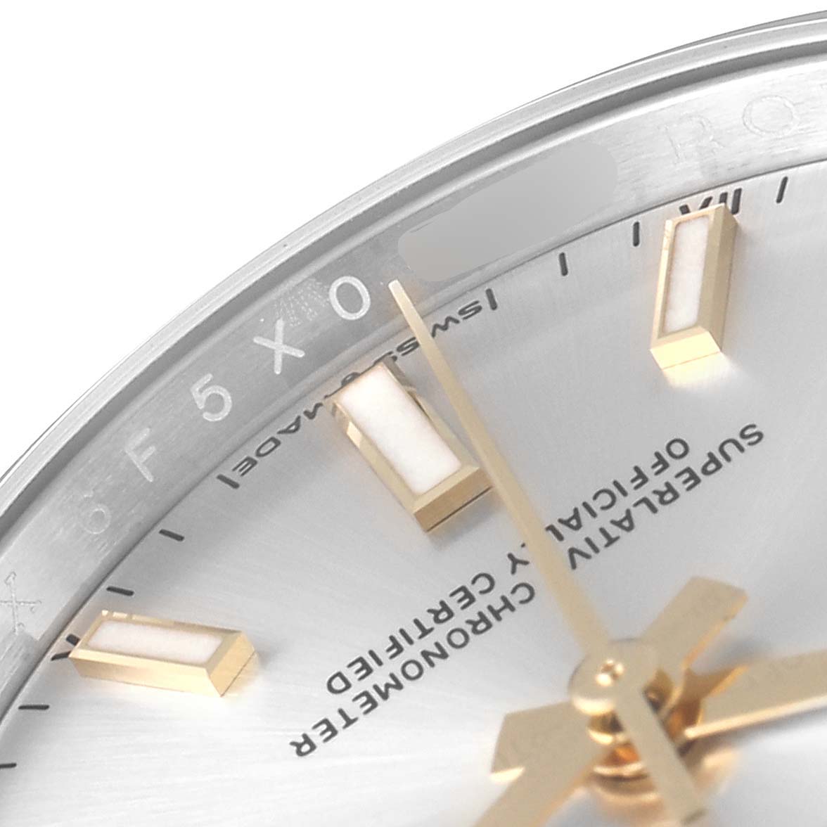 This close-up image of the Rolex Oyster Perpetual 124200 Men's Stainless Steel Silver Dial 124200 Men's Stainless Steel Silver Dial watch shows partial markers, the dial, and hour, minute, and second hands.