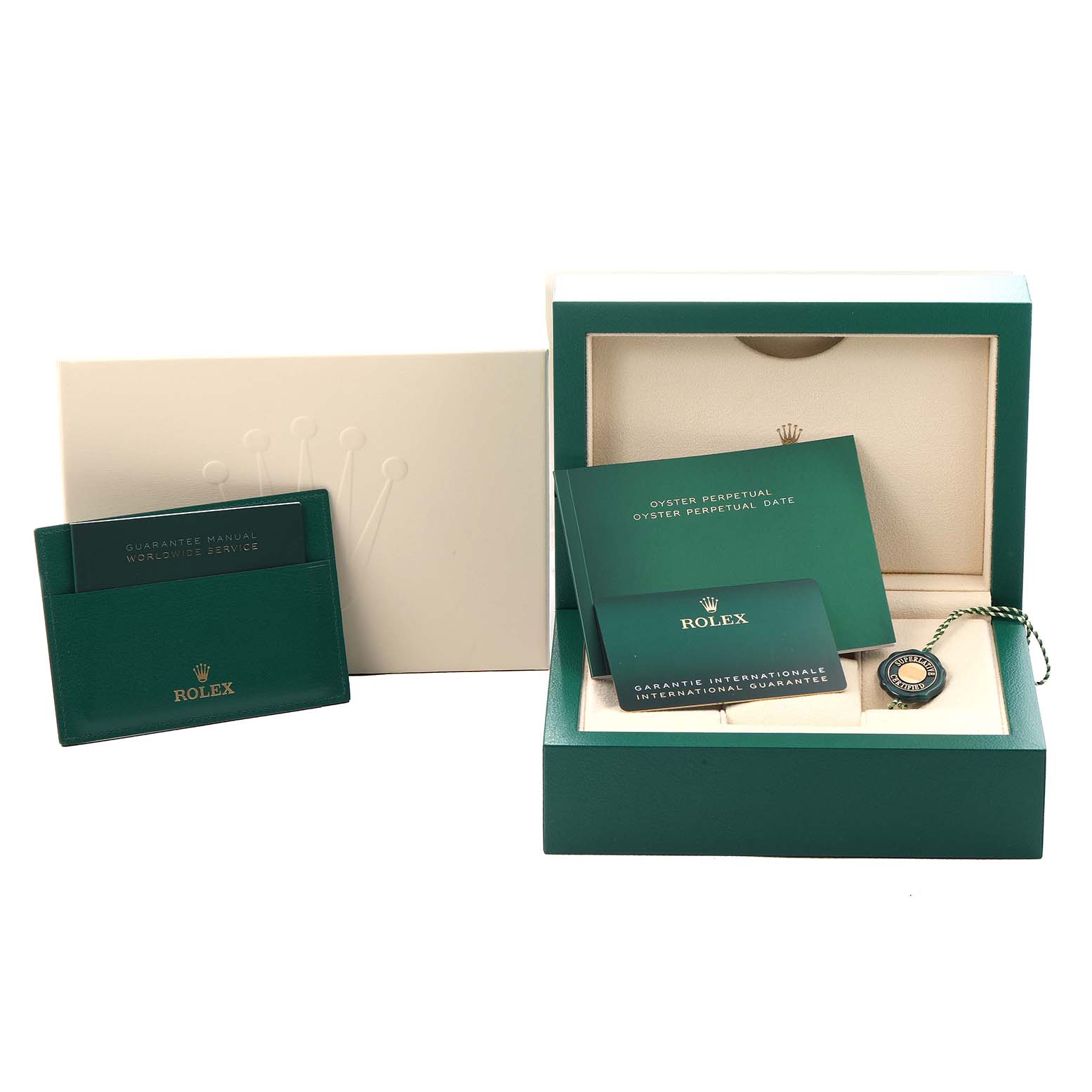 The image shows Rolex Oyster Perpetual 124300 Men
s Stainless Steel Blue Dial accessories: a box, guarantee manual, booklets, and a hang tag.