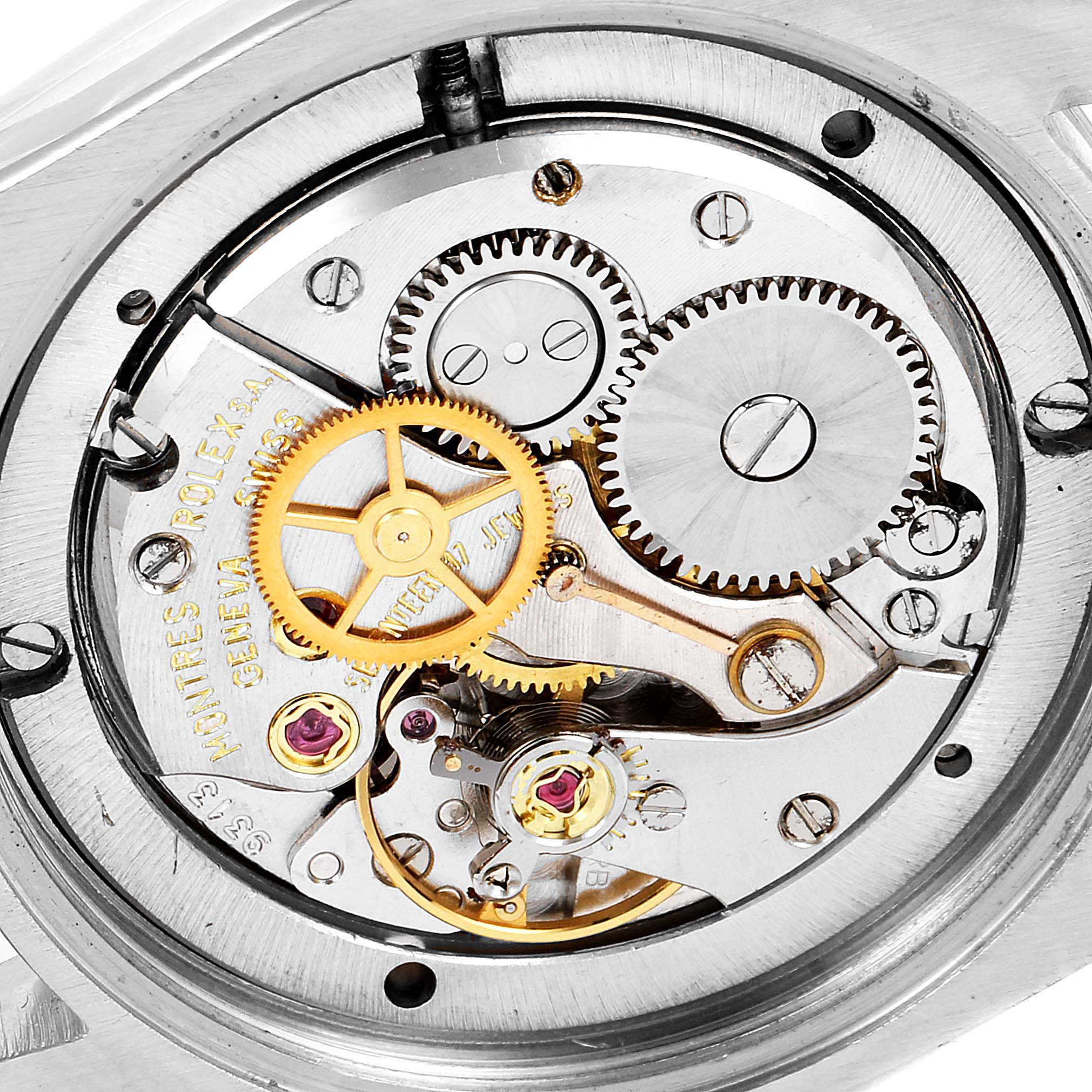 The image shows a close-up view of the internal gear mechanism and movement of a Vintage Collection Rolex watch.