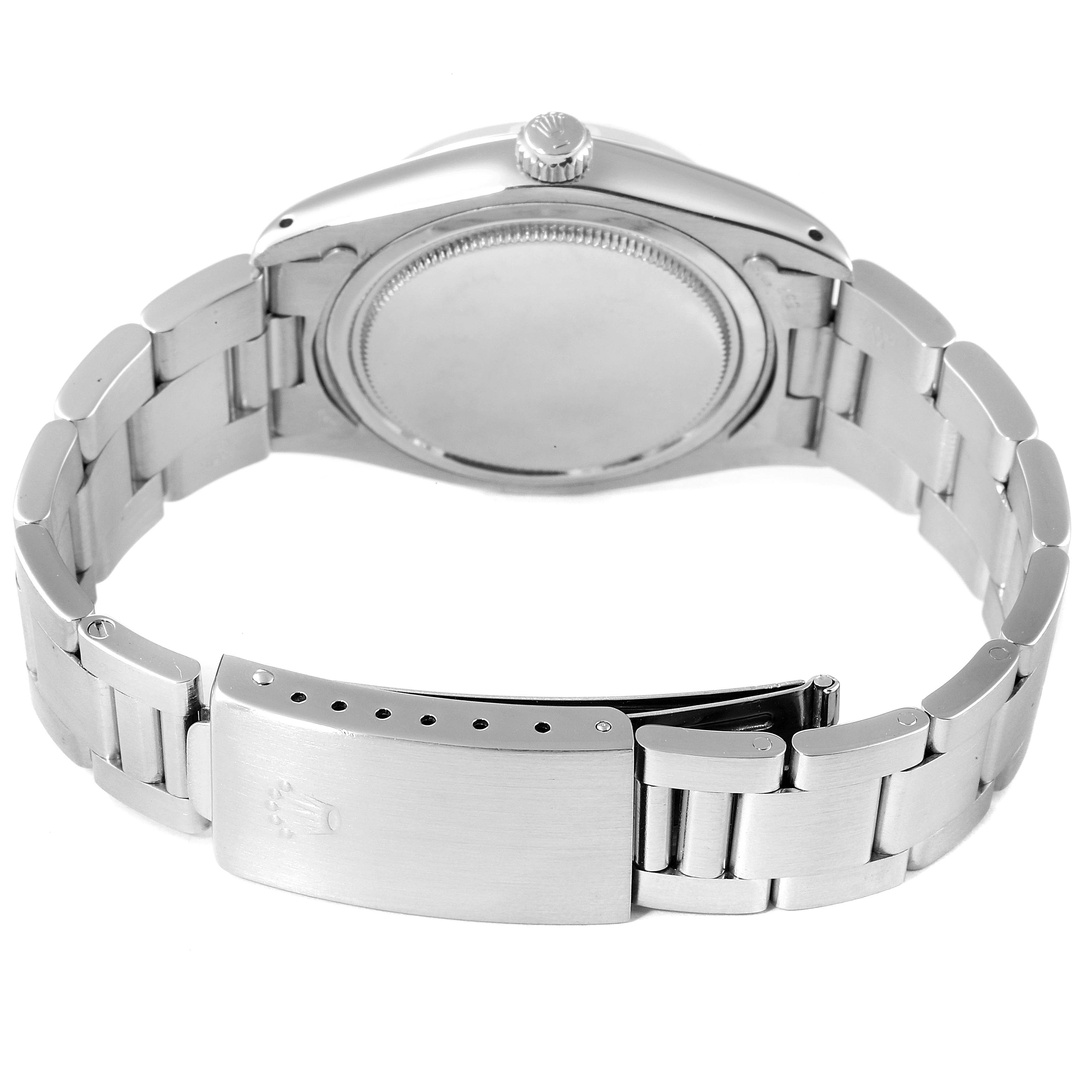 This image shows the back view of the Rolex Vintage Collection 6694 Men's Stainless Steel Silver Dial 6694 Men's Stainless Steel Silver Dial watch, highlighting its metal bracelet and clasp.
