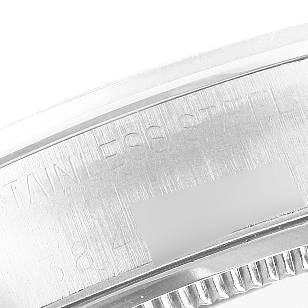 This image shows a close-up of the stainless steel case and part of the bezel of a Rolex Vintage Collection 6694 Men's Stainless Steel Silver Dial 6694 Men's Stainless Steel Silver Dial watch.