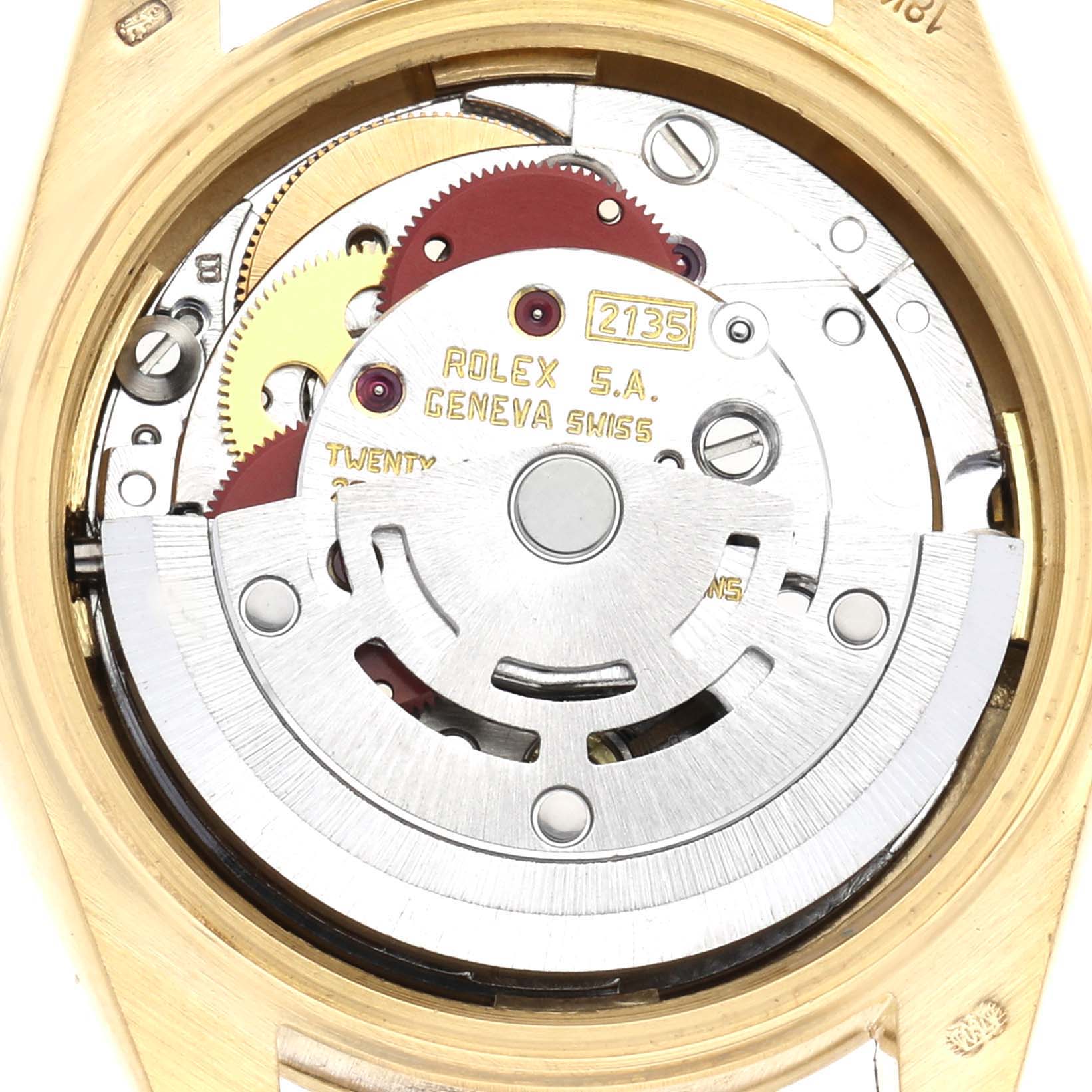 The image shows the intricate movement of a Rolex President 69278 Women
s Yellow Gold Champagne Dial model from the back, highlighting the mechanical components.