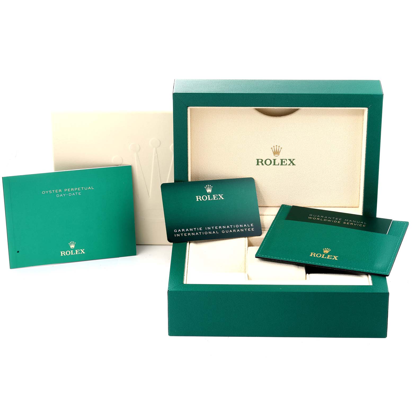 The image shows the accessories for the Rolex President 128239 Men's White Gold Blue Dial 128239 Men's White Gold Blue Dial model, including its box, manuals, and guarantee cards.