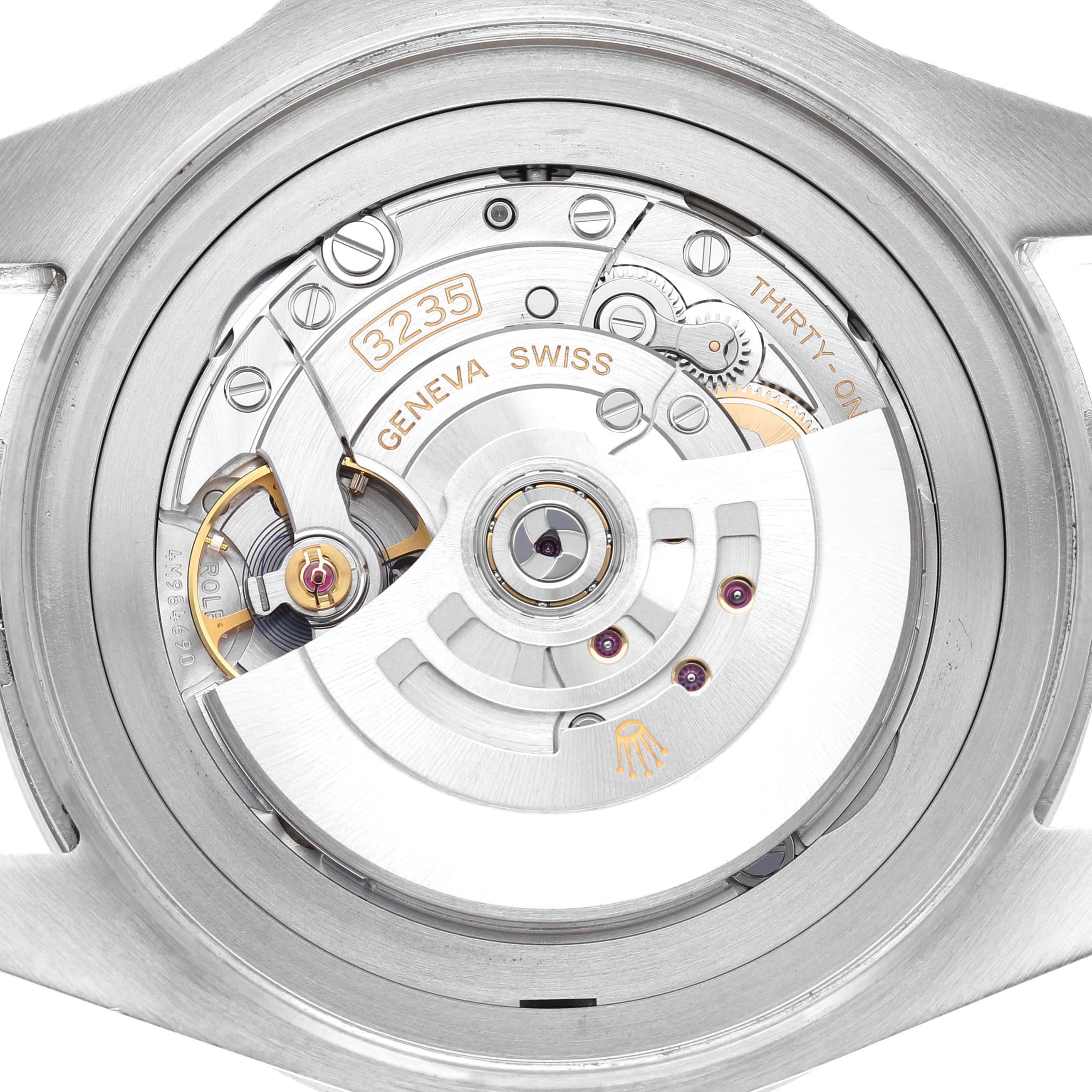 The image shows the rear view of the Rolex Sea-Dweller 126660 Men's Stainless Steel Blue Dial, highlighting its movement mechanism and intricate components.