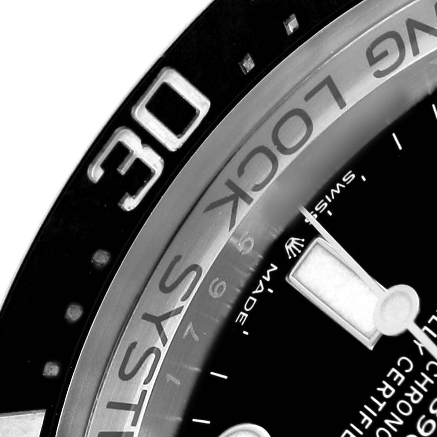 The image shows a close-up of the bezel, part of the dial, and the minute hand of the Rolex Sea-Dweller 126660 Men's Stainless Steel Blue Dial.