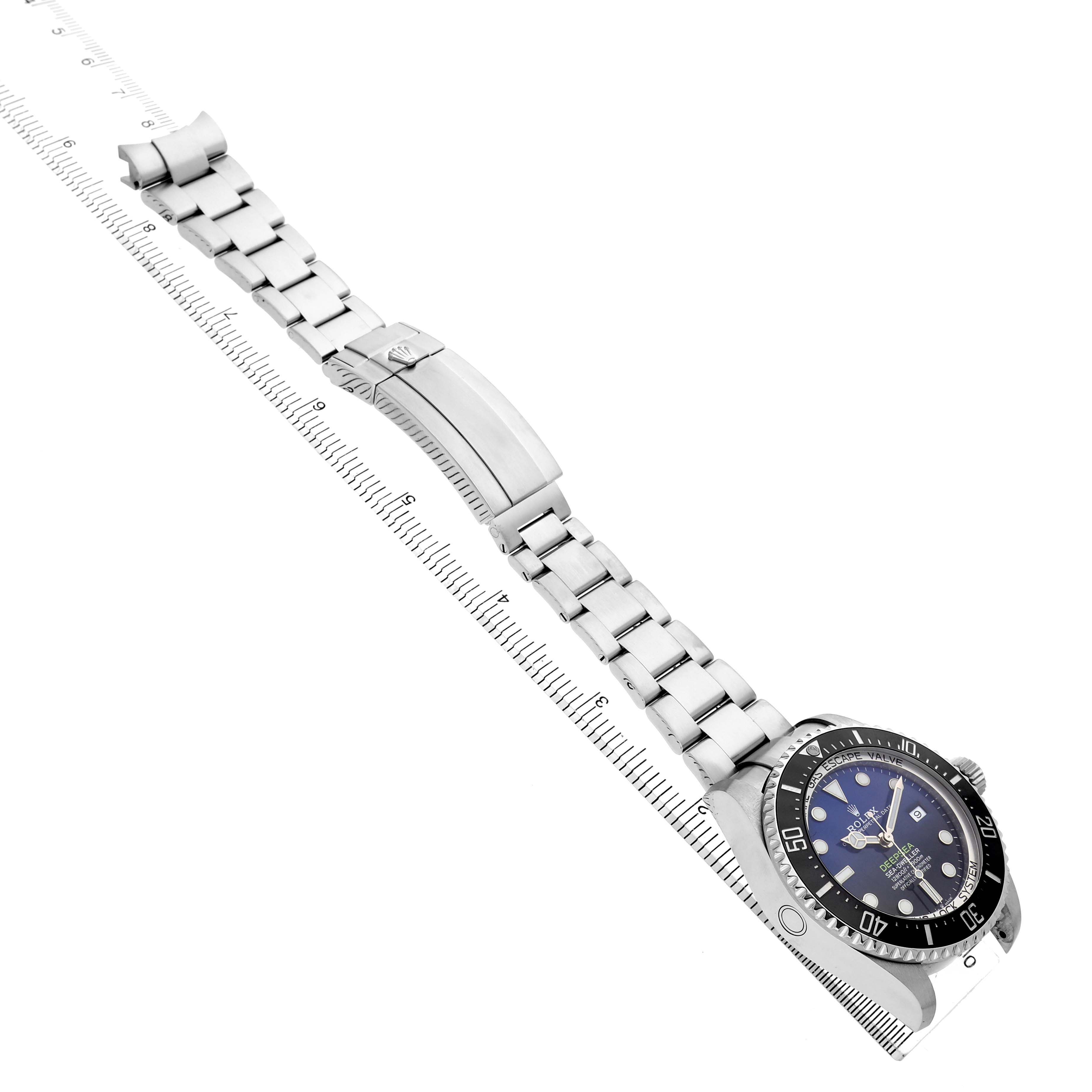 The Rolex Sea-Dweller 126660 Men's Stainless Steel Blue Dial watch is shown from an angled side view, displaying its face, bezel, bracelet, and clasp.