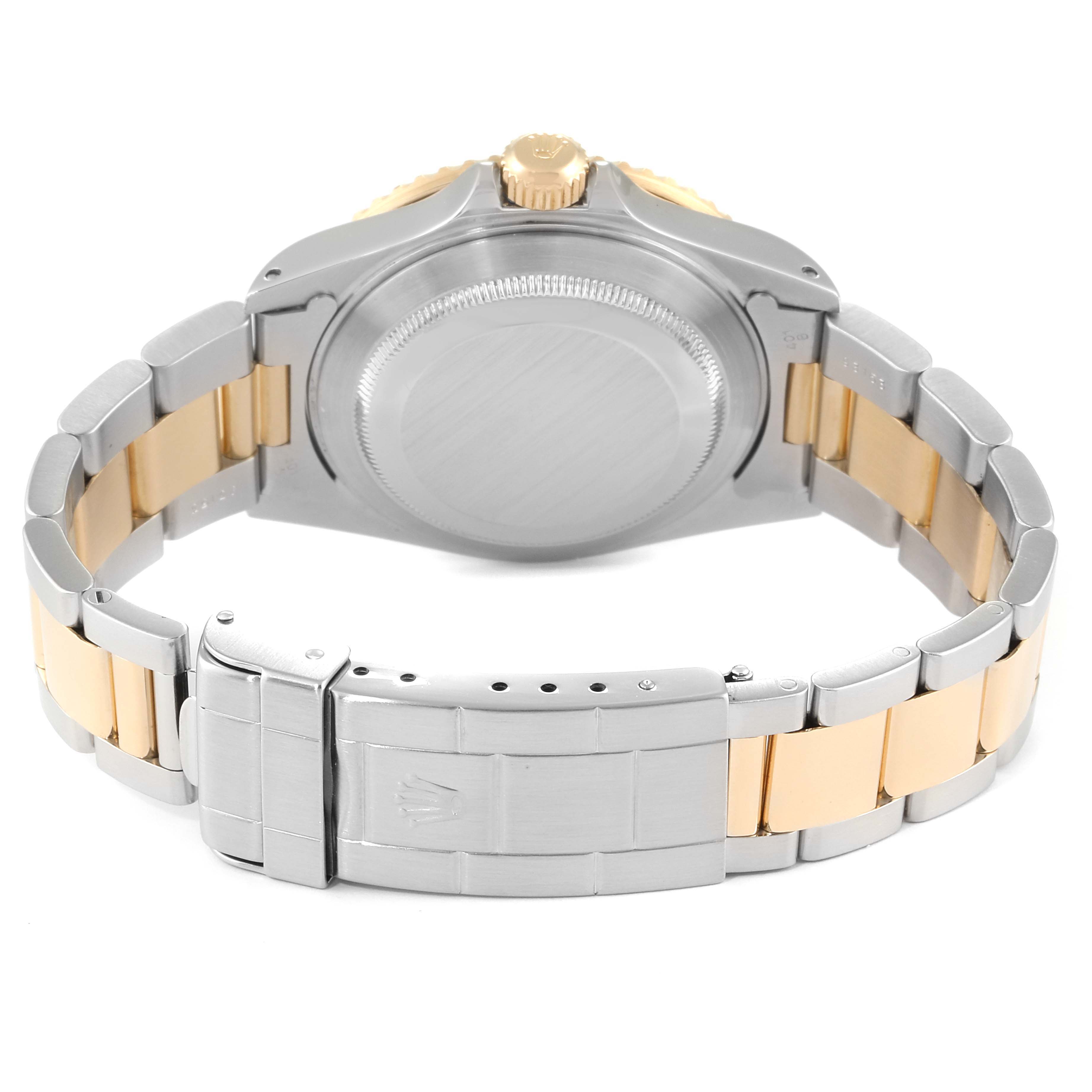 The image shows the back case and bracelet clasp of a Rolex Submariner 16613 Men
s Steel and Gold (two tone) Black Dial 16613 Men
s Steel and Gold (two tone) Black Dial watch from a rear angle.