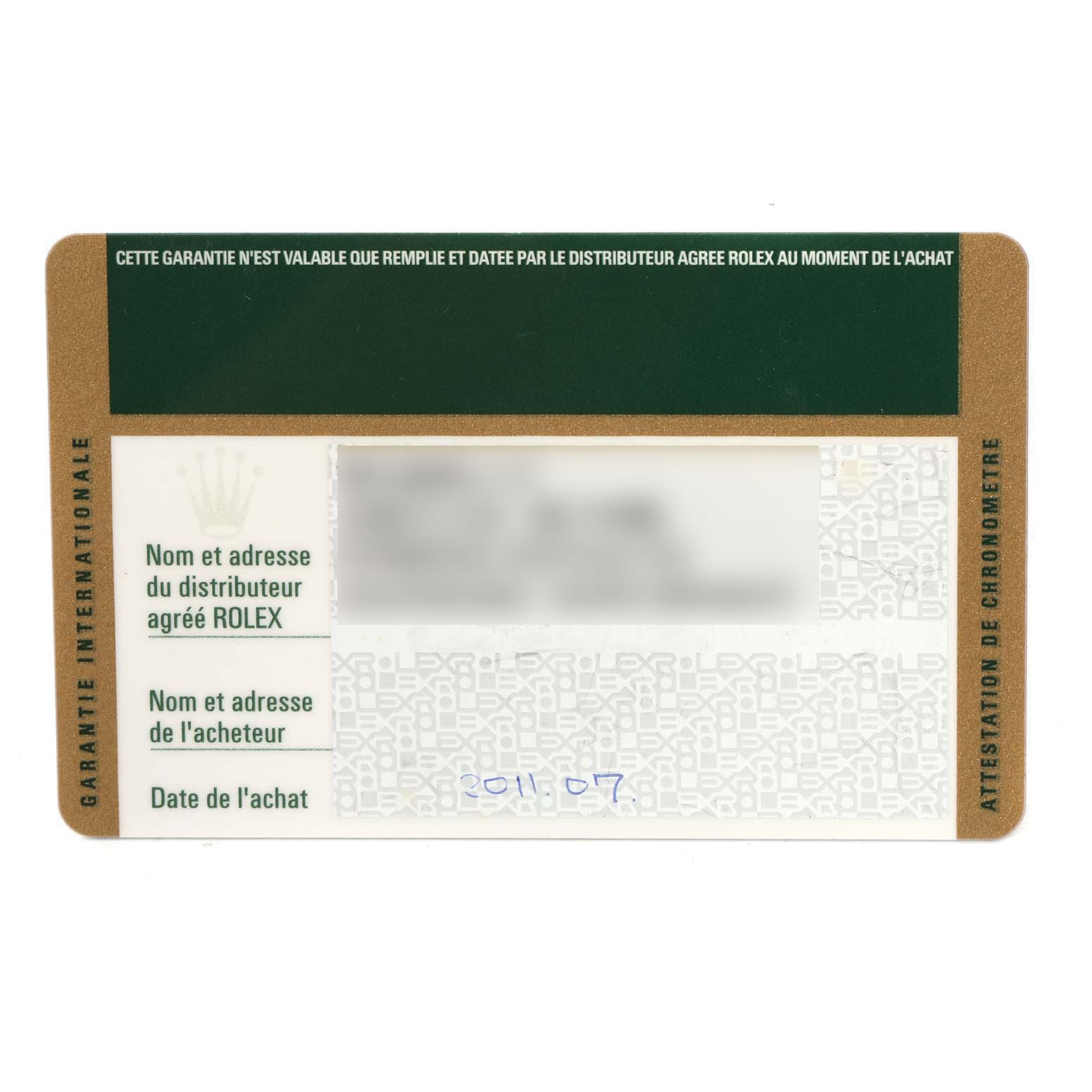 This image shows the international warranty card of a Rolex Submariner 116610LN Men
s Stainless Steel Black Dial 116610LN Men
s Stainless Steel Black Dial watch from a top-down angle.