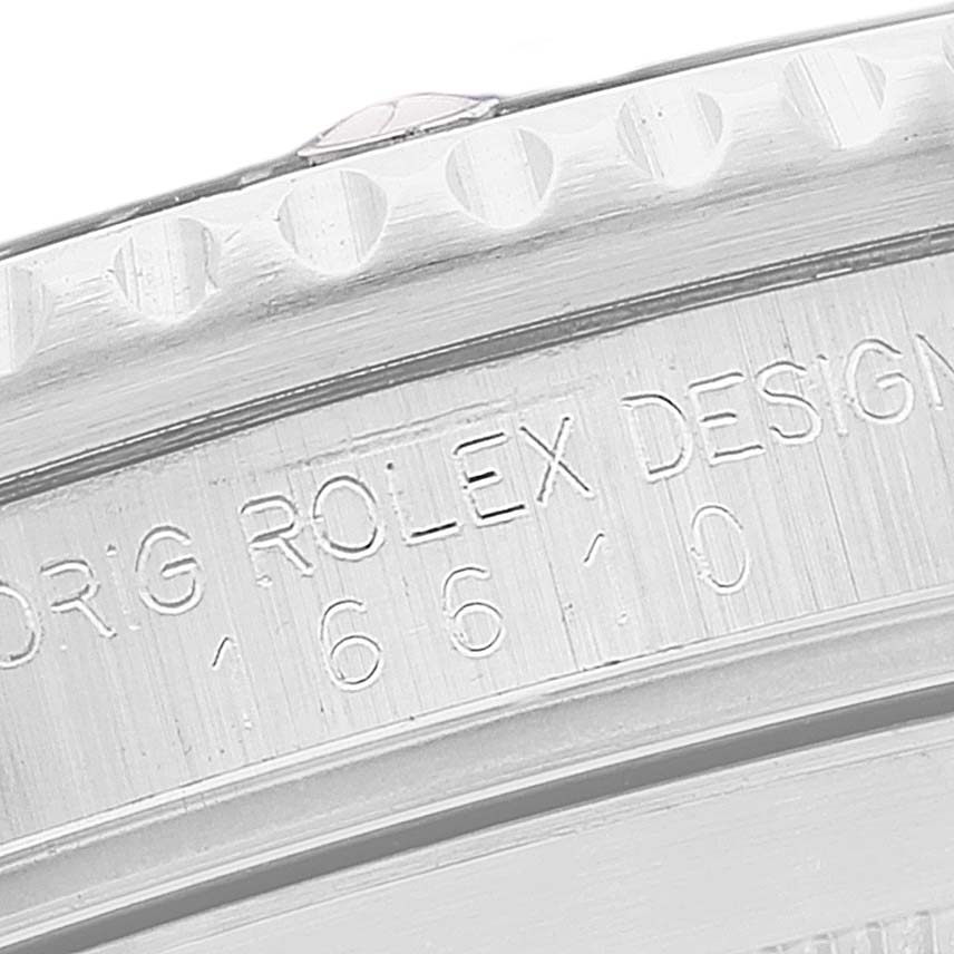 This close-up image shows the engraved text on the case back of a Rolex Submariner 16610 Men
s Stainless Steel Black Dial 16610 Men
s Stainless Steel Black Dial model.
