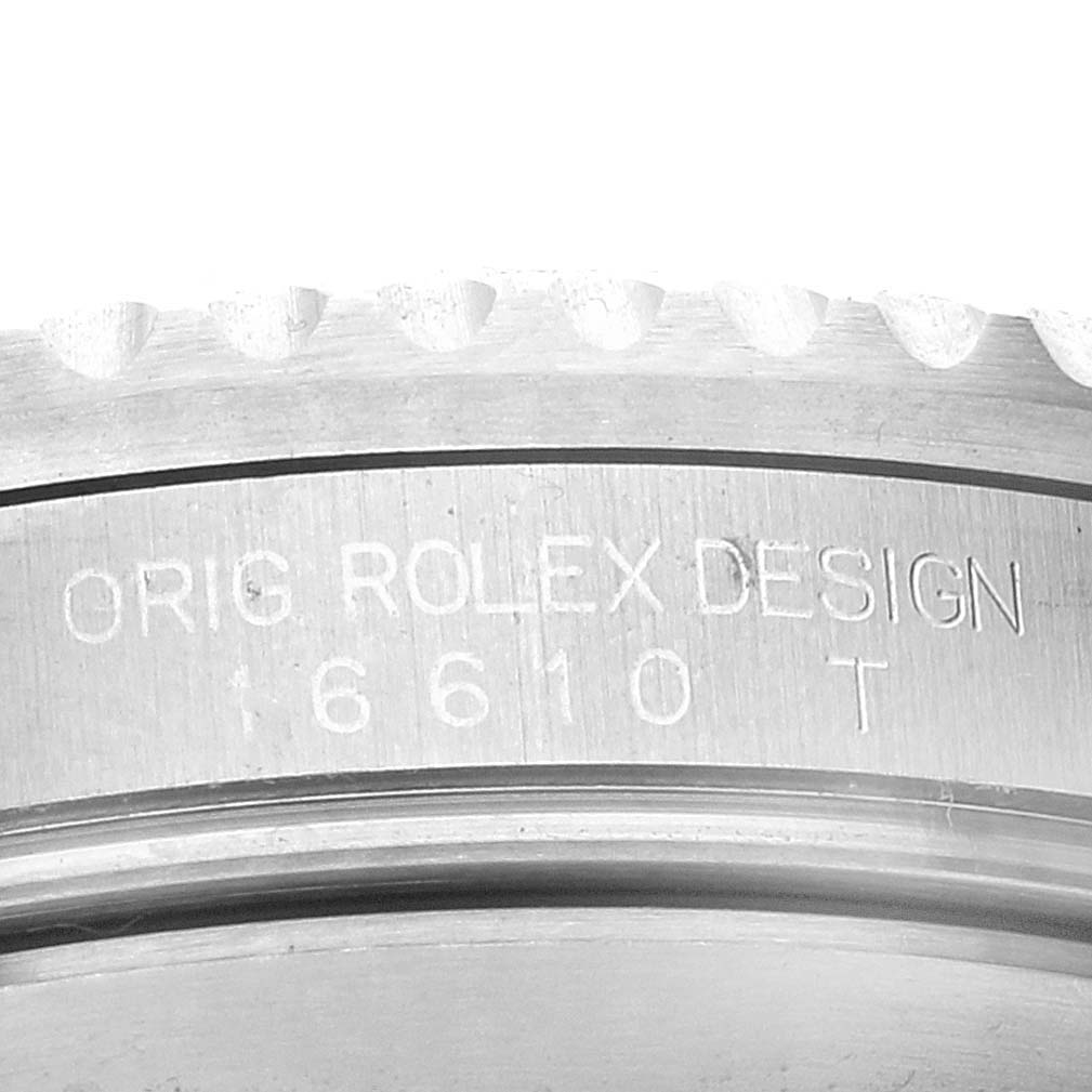 This image shows a close-up view of the case side of a Rolex Submariner 16610 Men
s Stainless Steel Black Dial 16610 Men
s Stainless Steel Black Dial, highlighting the engraved model number 16610.