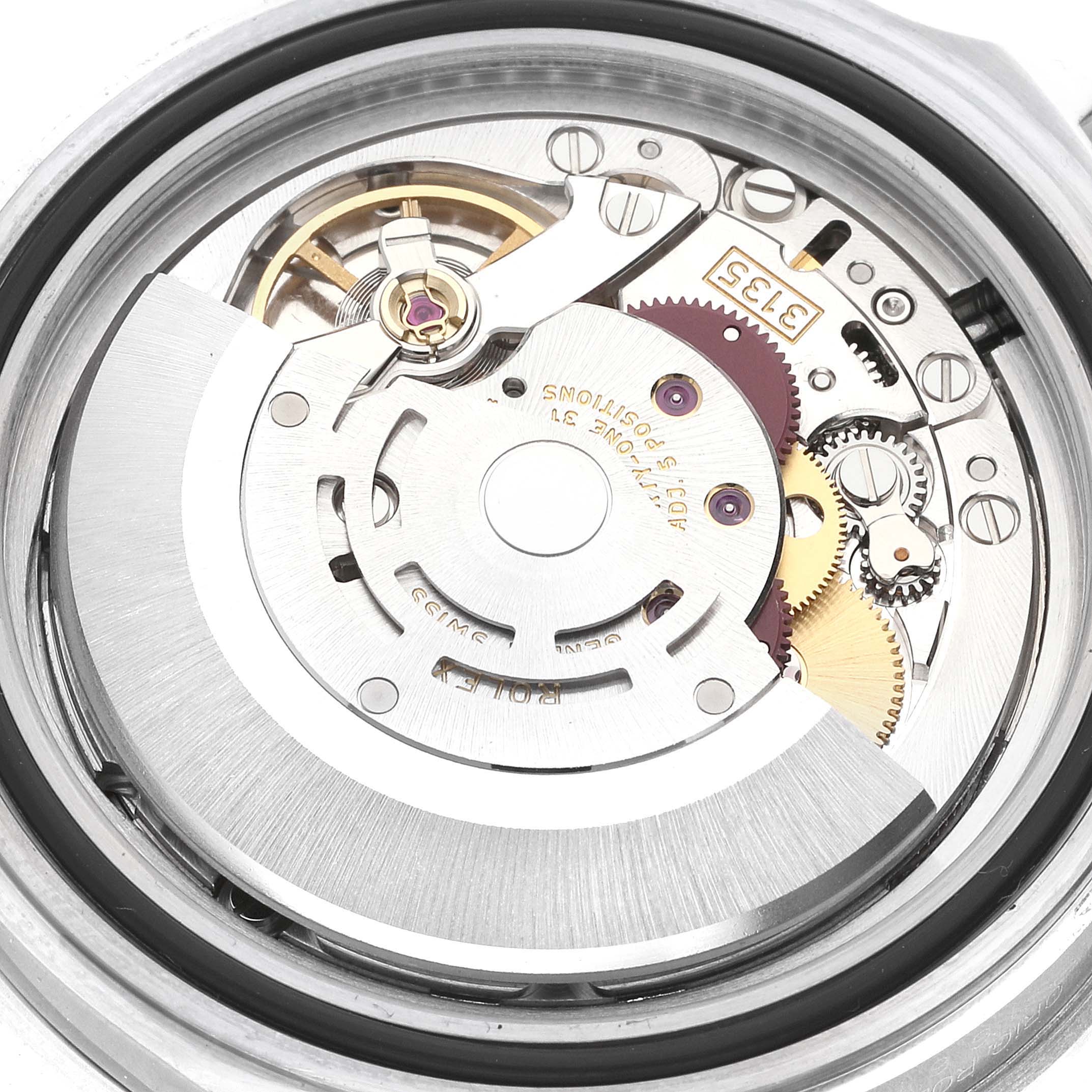 The image shows a close-up of the internal mechanical movement of a Rolex Submariner 16610 Men
s Stainless Steel Black Dial 16610 Men
s Stainless Steel Black Dial watch from a top-down angle.