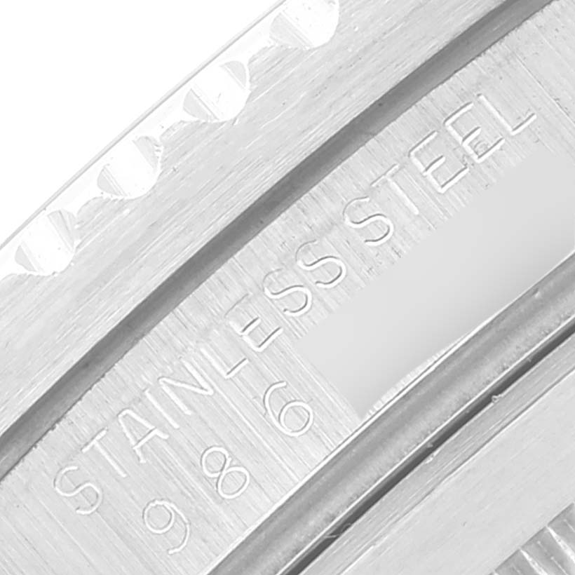 This is a close-up angle showing the stainless steel engraving and part of the bezel of the Rolex Submariner 16800 Men
s Stainless Steel Black Dial 16800 Men
s Stainless Steel Black Dial watch.