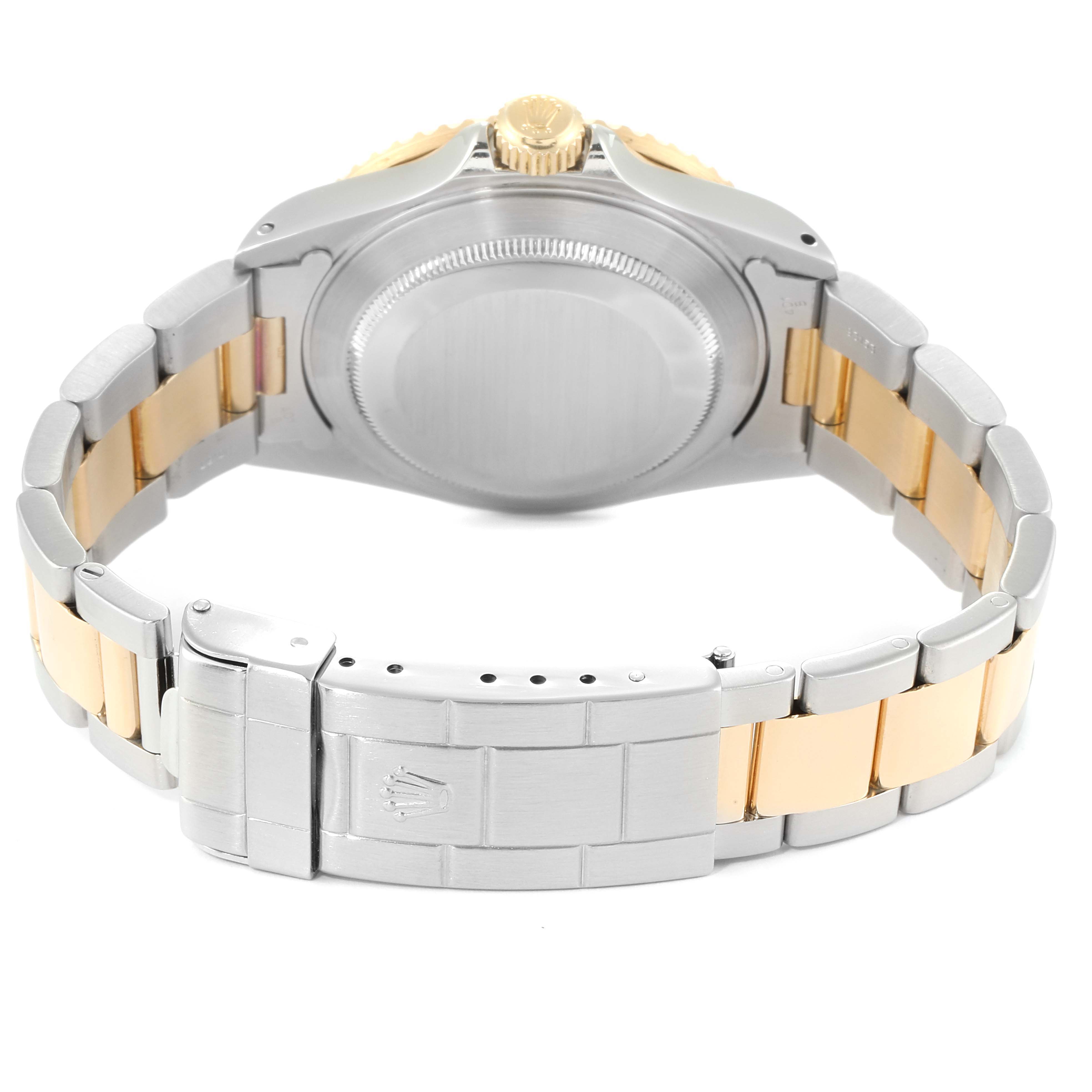 The image shows the back view of a Rolex Submariner 16613 Men's Steel and Gold (two tone) Black Dial 16613 Men's Steel and Gold (two tone) Black Dial watch, highlighting its two-tone bracelet and clasp.