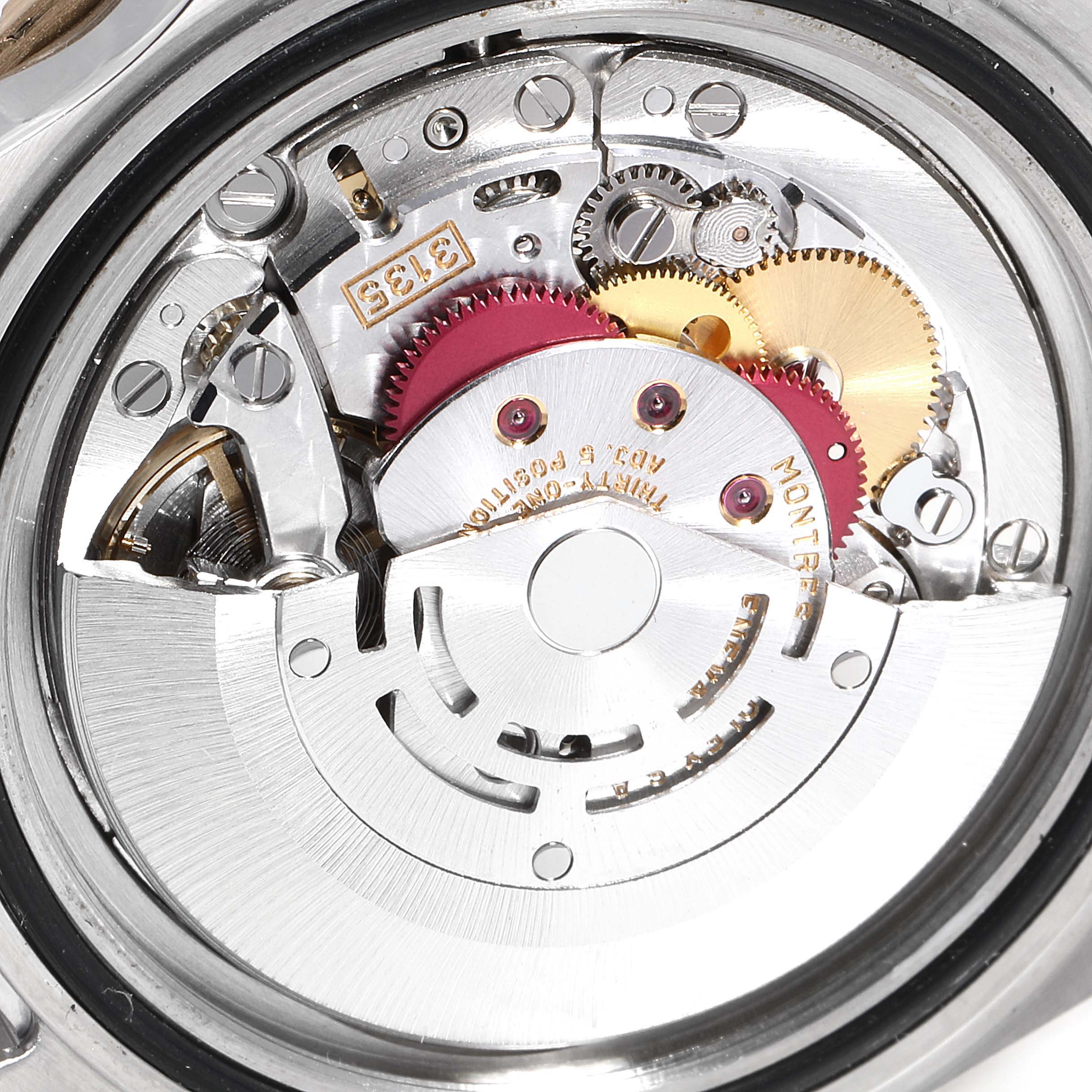The image shows a close-up view of the movement mechanism of a Rolex Submariner 16613 Men's Steel and Gold (two tone) Black Dial 16613 Men's Steel and Gold (two tone) Black Dial watch.