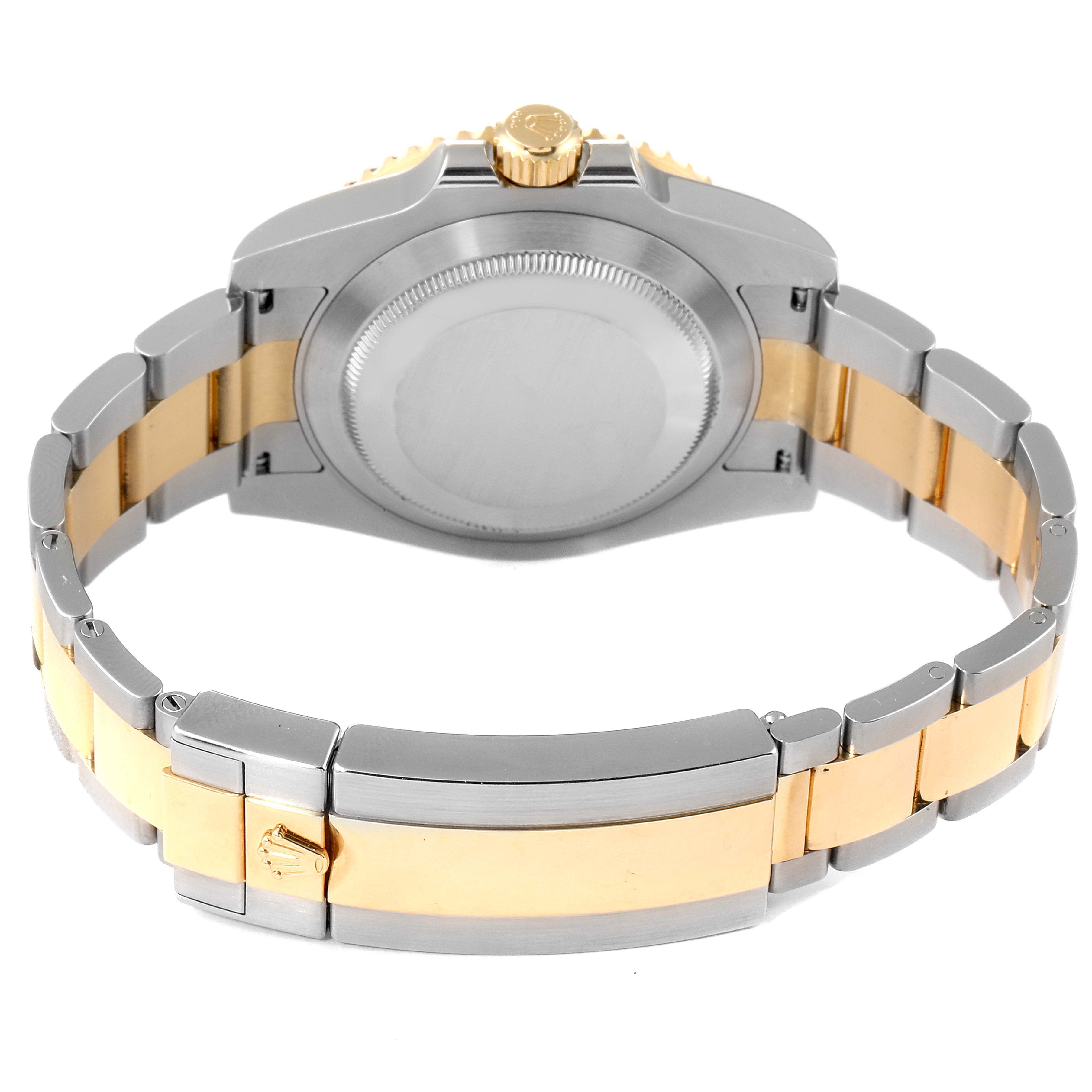 The image shows the back and bracelet of a Rolex Submariner 116613 Men
s Steel and Gold (two tone) Black Dial 116613 Men
s Steel and Gold (two tone) Black Dial watch from a rear angle.