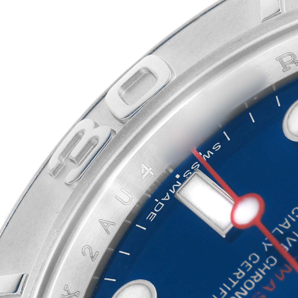 The image shows a close-up of the bezel and dial of a Rolex Yacht-Master 116622 Men's Stainless Steel Blue Dial watch, featuring part of the minute markers and a red hand.