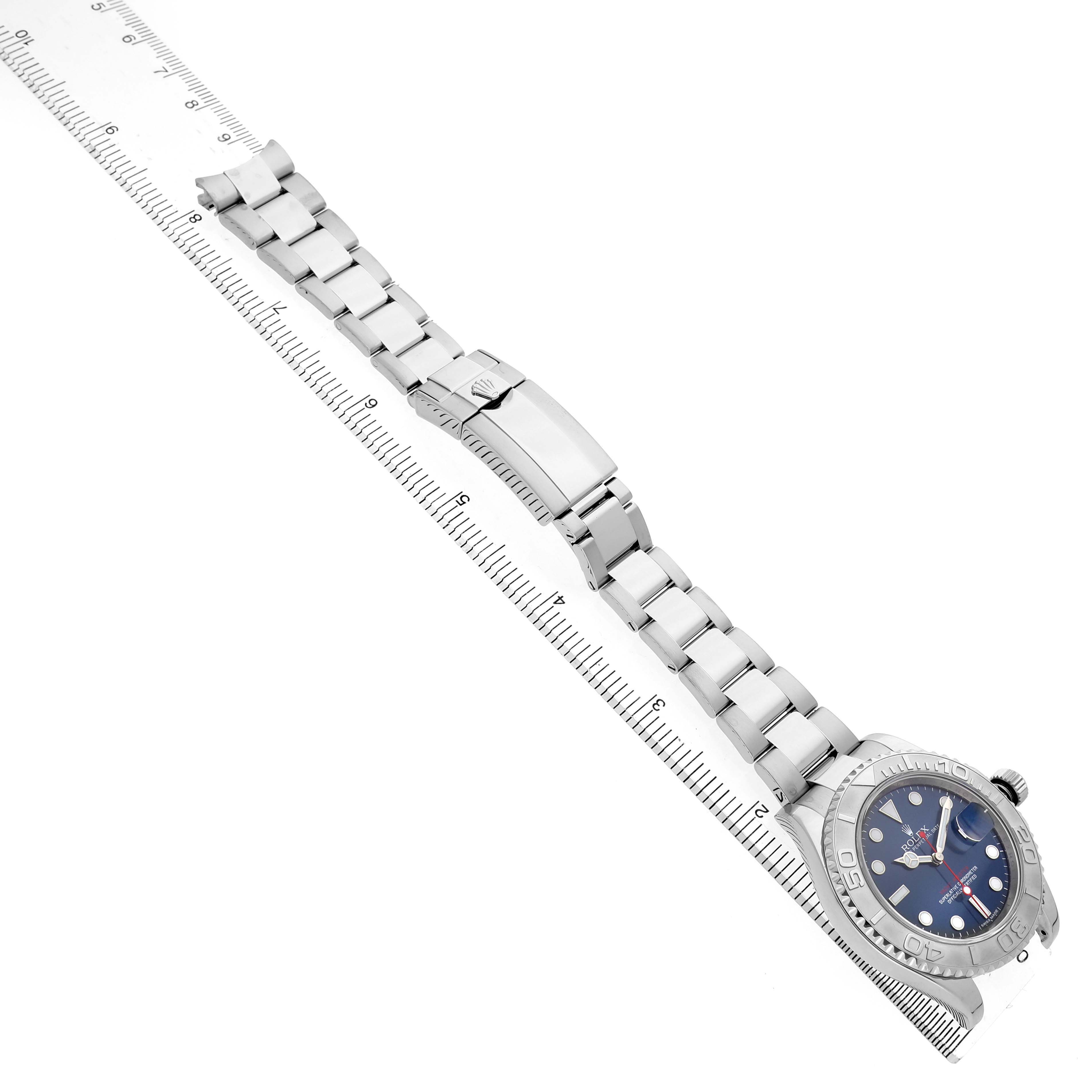 The image shows a Rolex Yacht-Master 116622 Men's Stainless Steel Blue Dial watch from an overhead angle, displaying the bracelet, clasp, and dial.