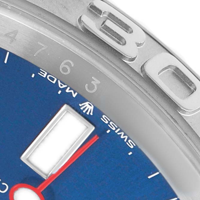 The image shows a close-up of a Rolex Yacht-Master 126622 Men's Stainless Steel Blue Dial watch face, focusing on the bezel, part of the blue dial, and a red hand.