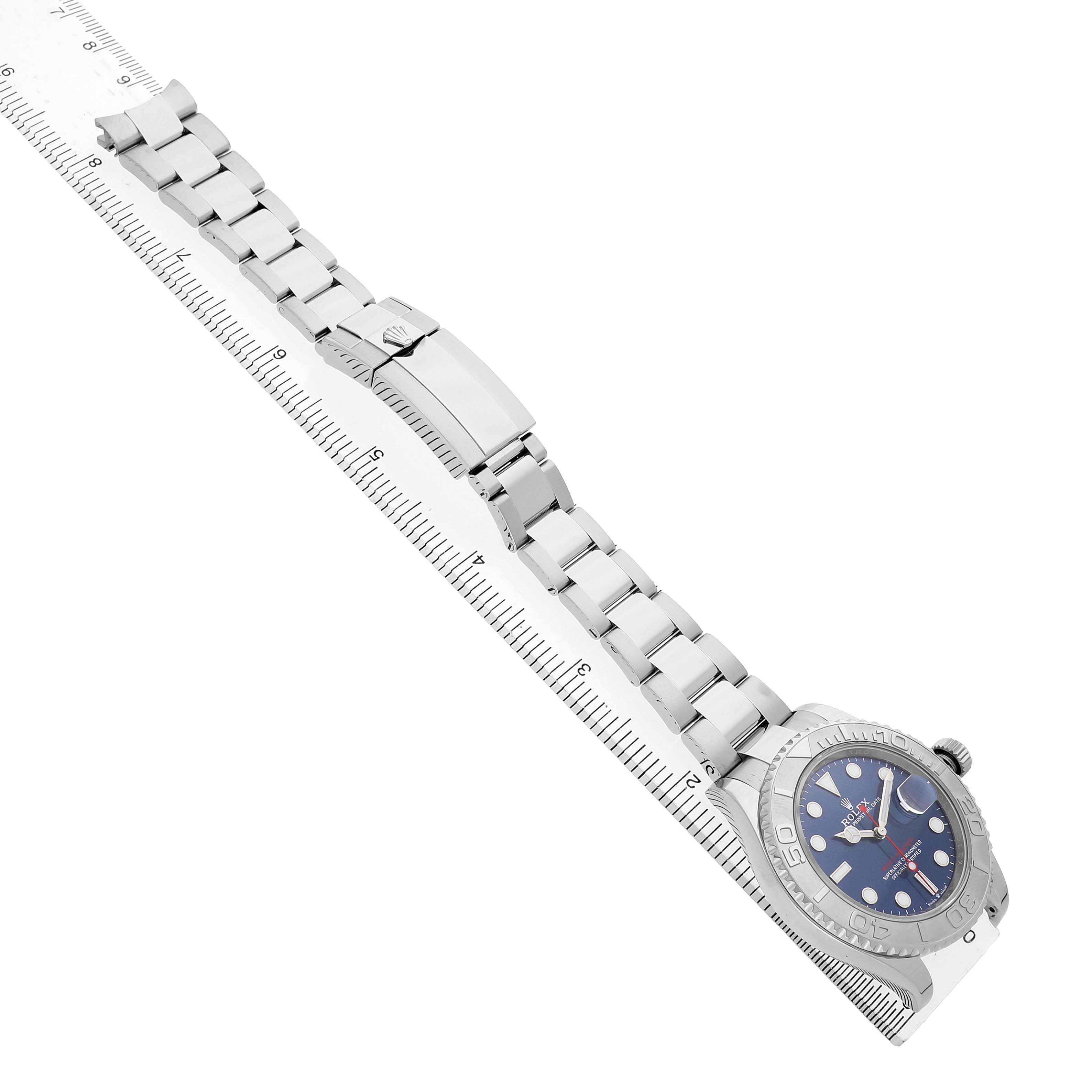 The Rolex Yacht-Master 126622 Men's Stainless Steel Blue Dial watch is displayed diagonally, showing the face, bezel, and full bracelet alongside a ruler.