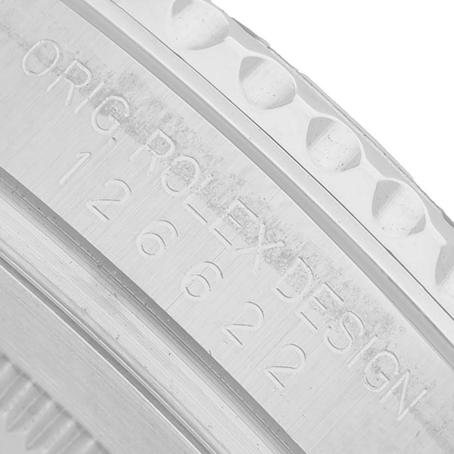 The image shows a close-up of the edge and engraving on the bezel of a Rolex Yacht-Master 126622 Men's Stainless Steel Blue Dial watch.