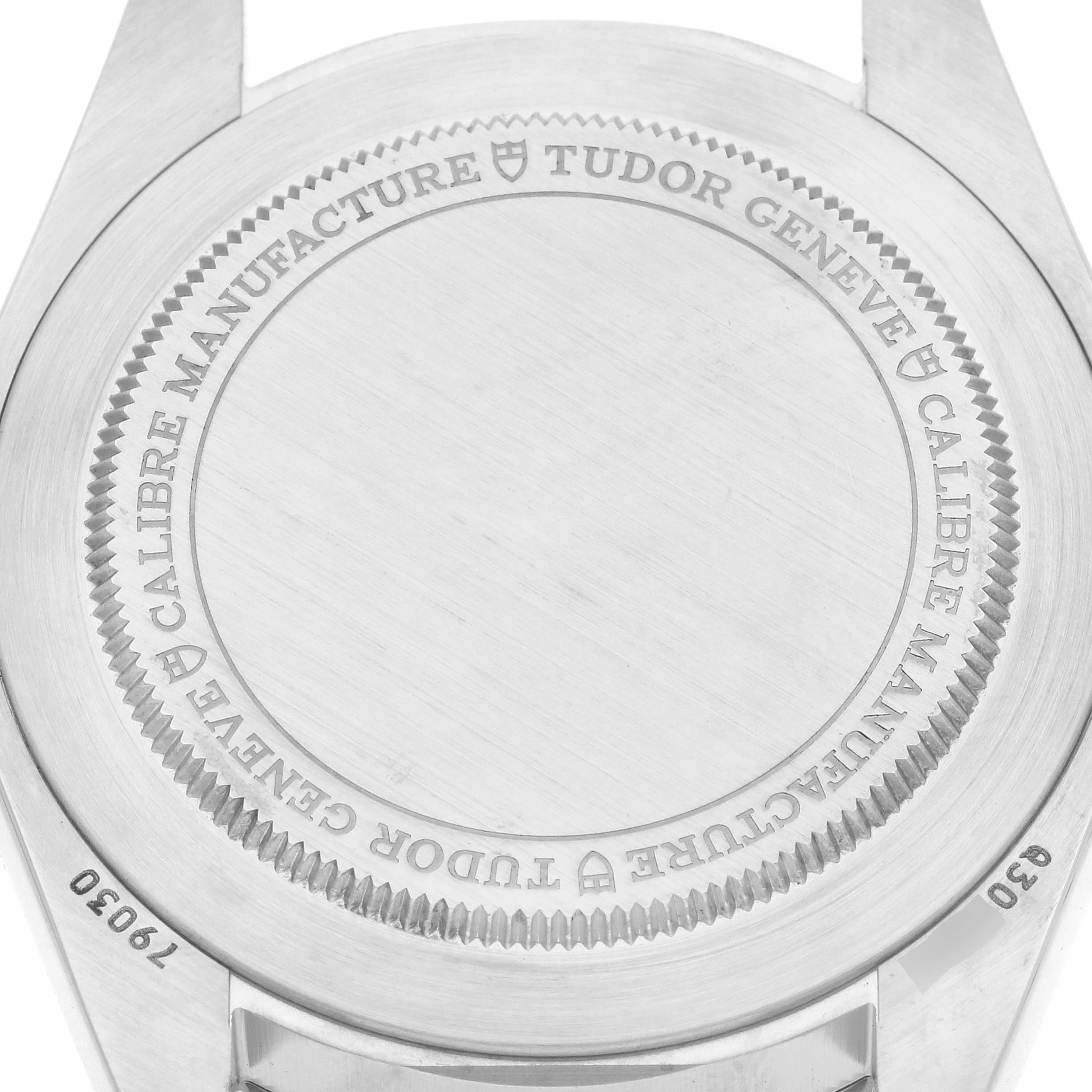 The image shows the case back of the Tudor Heritage Black Bay 79030N Men
s Stainless Steel Black Dial watch, viewed from above.