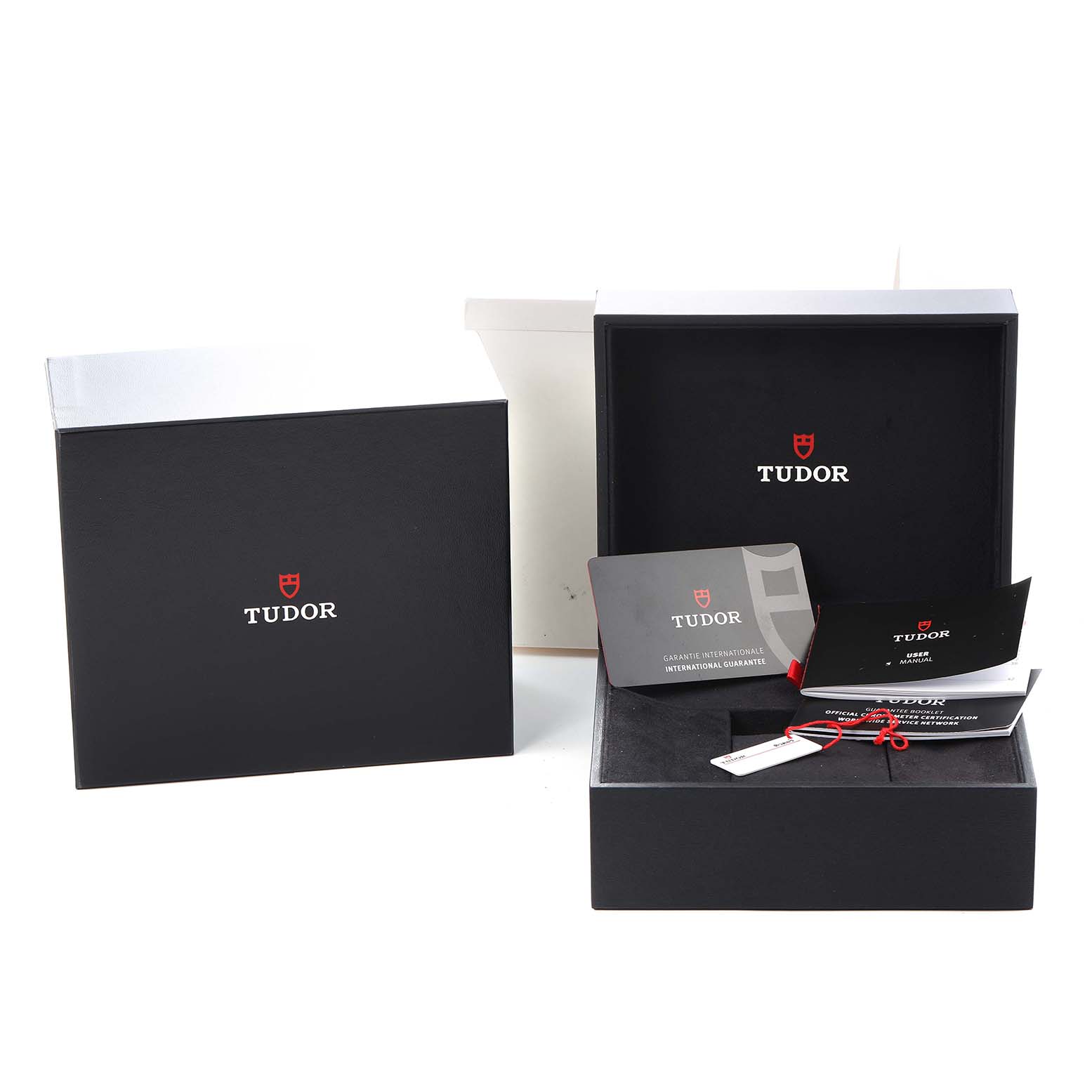 The image shows the Tudor Heritage Black Bay 79030N Men
s Stainless Steel Black Dial watch packaging and accessories, including the box, warranty card, and manual.