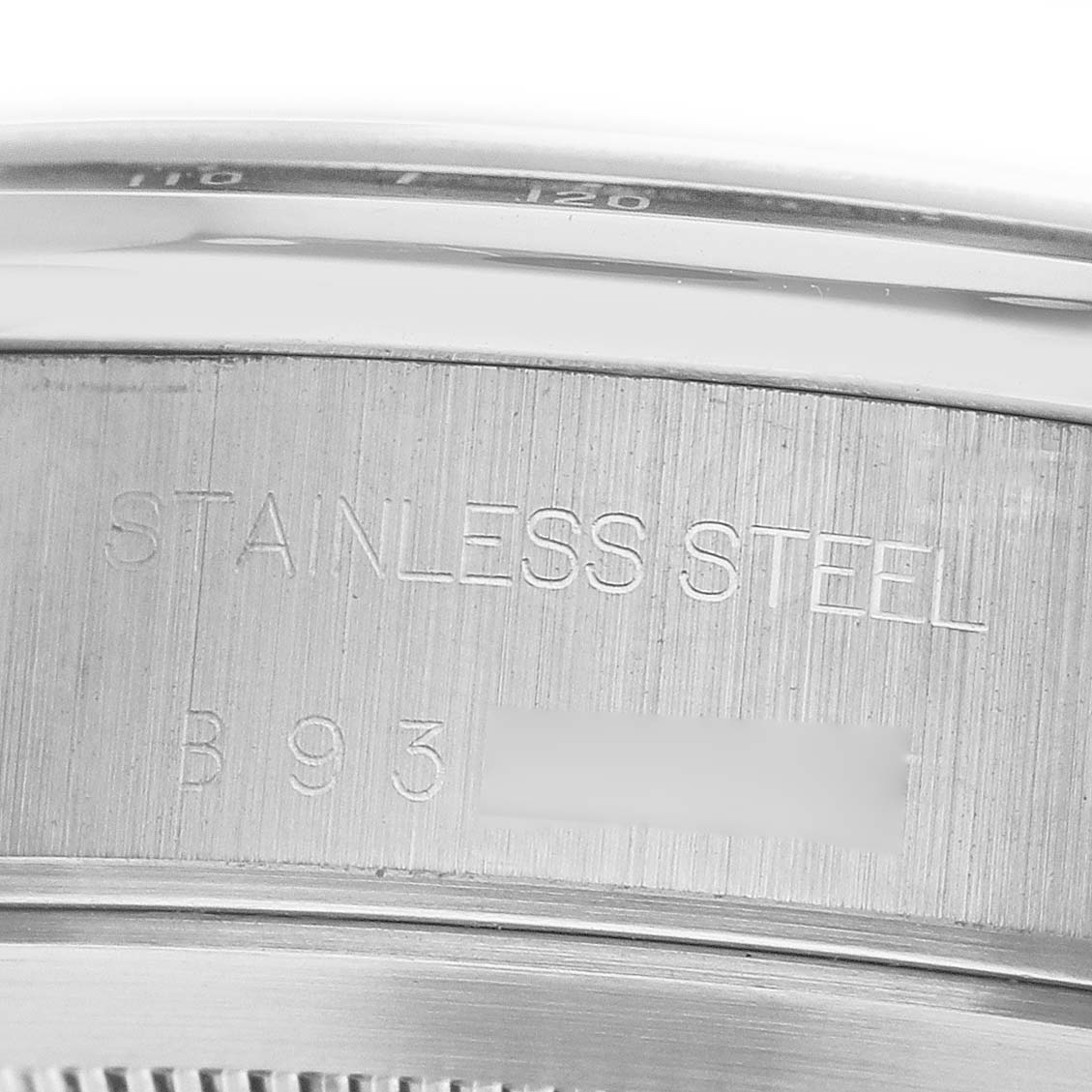 The image shows a close-up of the stainless steel back of a Tudor Prince 79260 Men's Stainless Steel Silver Dial watch, highlighting engravings.