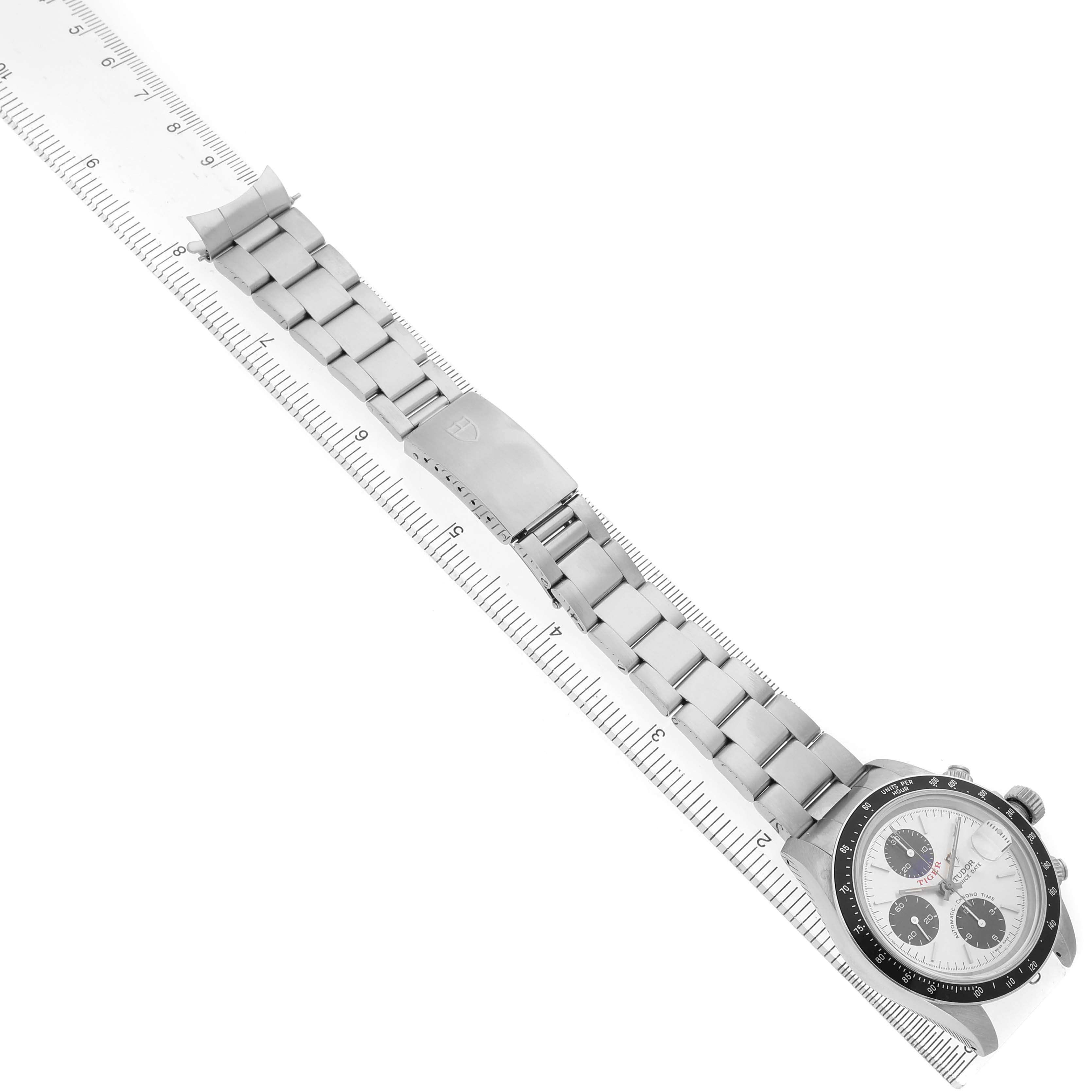 The Tudor Prince 79260 Men's Stainless Steel Silver Dial watch is shown at an angled view displaying the full bracelet, clasp, and watch face with a ruler for scale.