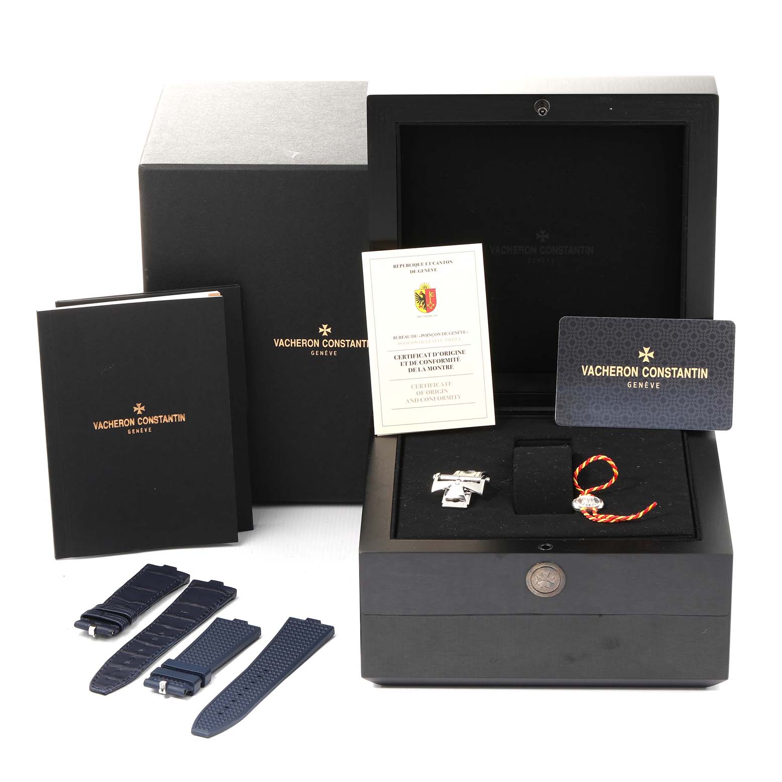 The image shows the Vacheron Constantin Overseas 7900V/110A-B334 Men's Stainless Steel Blue Dial 7900V/110A-B334 Men's Stainless Steel Blue Dial model watch with its box, documents, and additional watch straps.