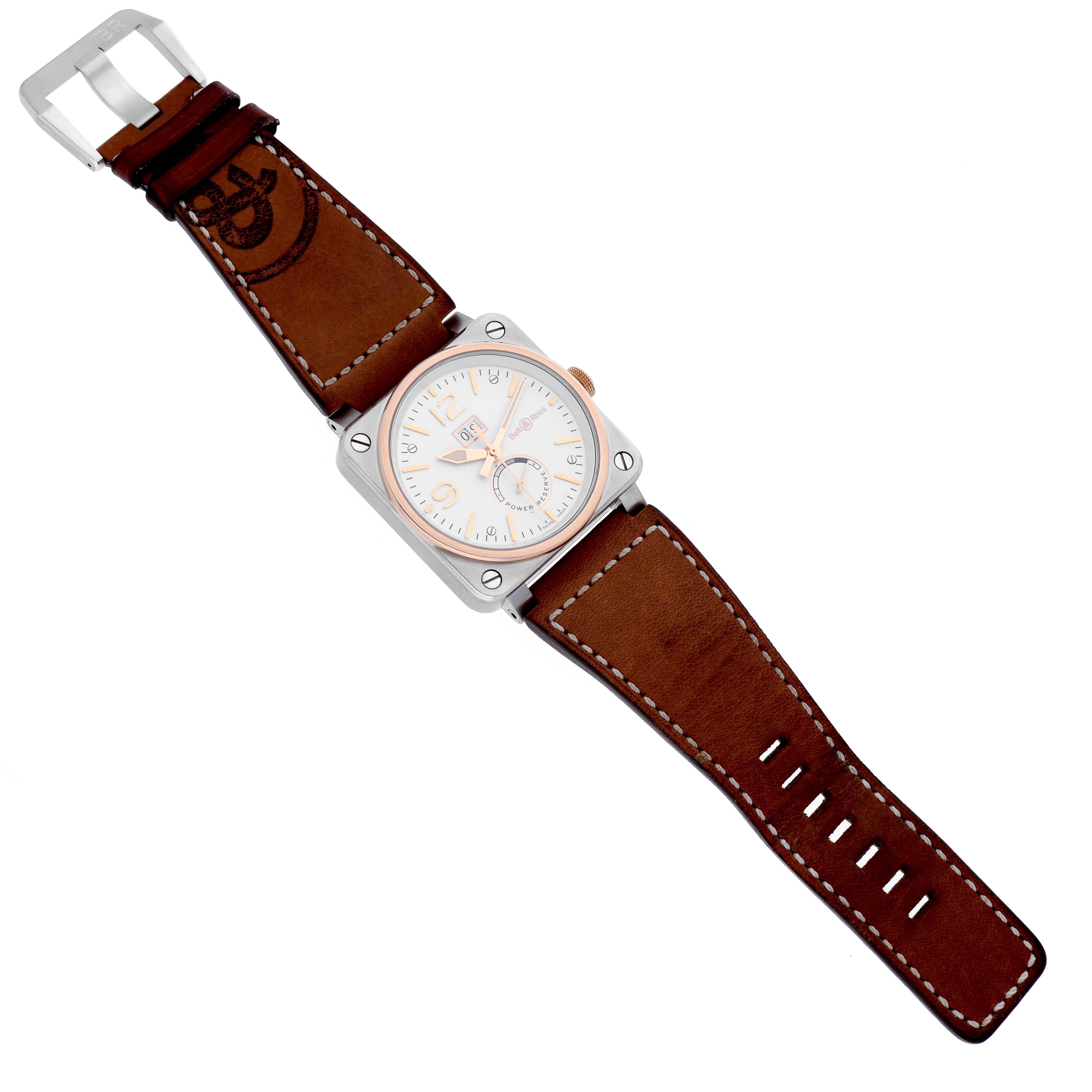 The Bell 
Ross Instruments BR03-90 Men
s Steel and Gold (two tone) Silver Dial BR03-90 Men
s Steel and Gold (two tone) Silver Dial model watch is shown from a top view, displaying the face, case, and leather strap with a buckle.