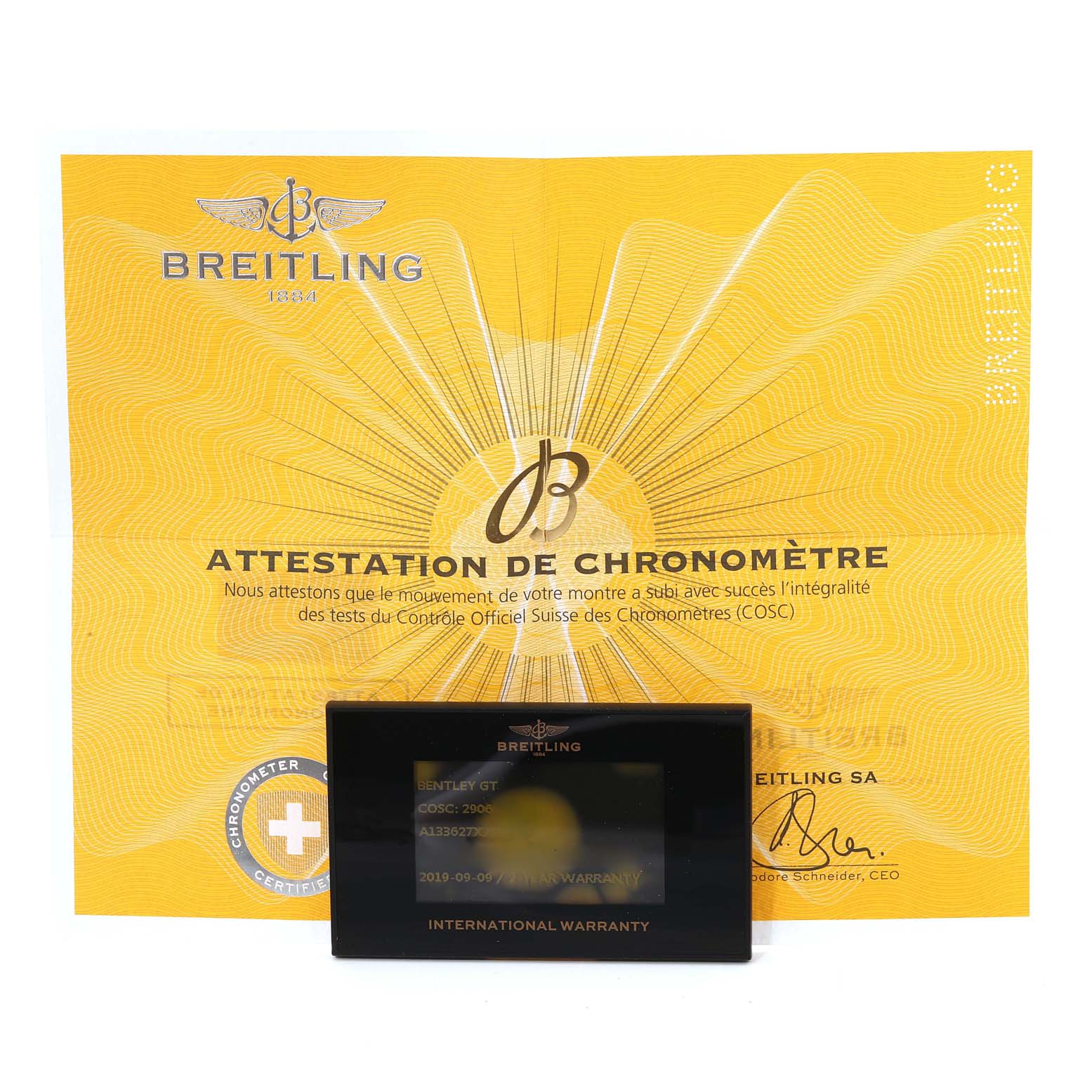 The image shows the certificate and warranty card for the Bentley model by Breitling.