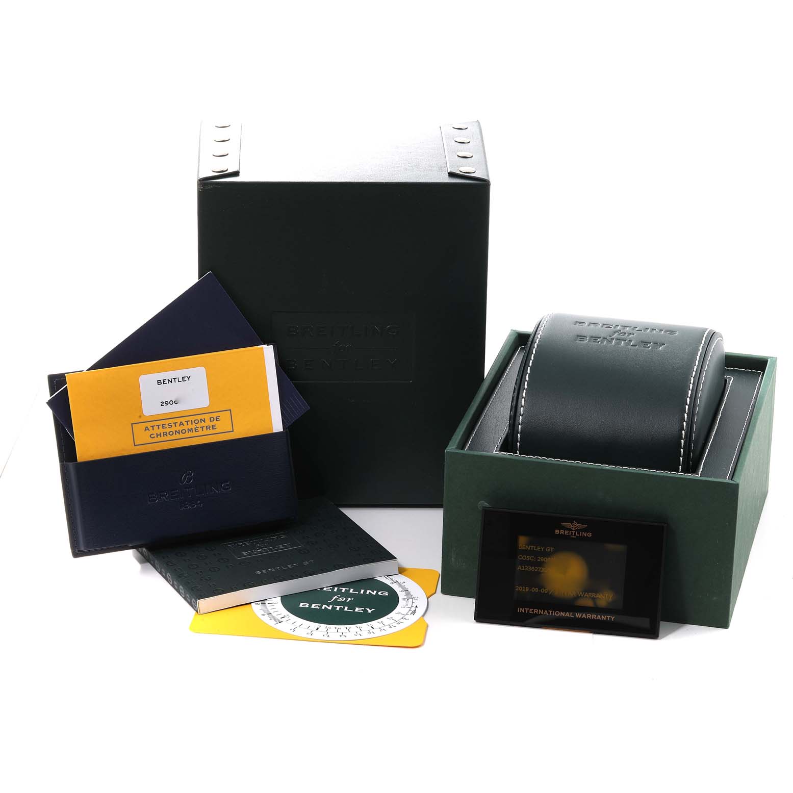 The image shows the packaging, documentation, and warranty card for a Bentley model by Breitling.