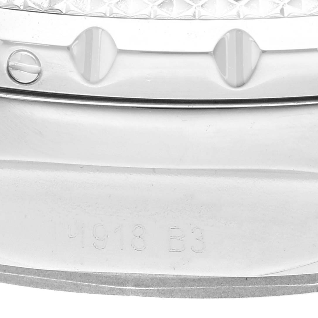 The image shows a close-up of the side and bezel of a Bentley model by Breitling, revealing text and screw details.