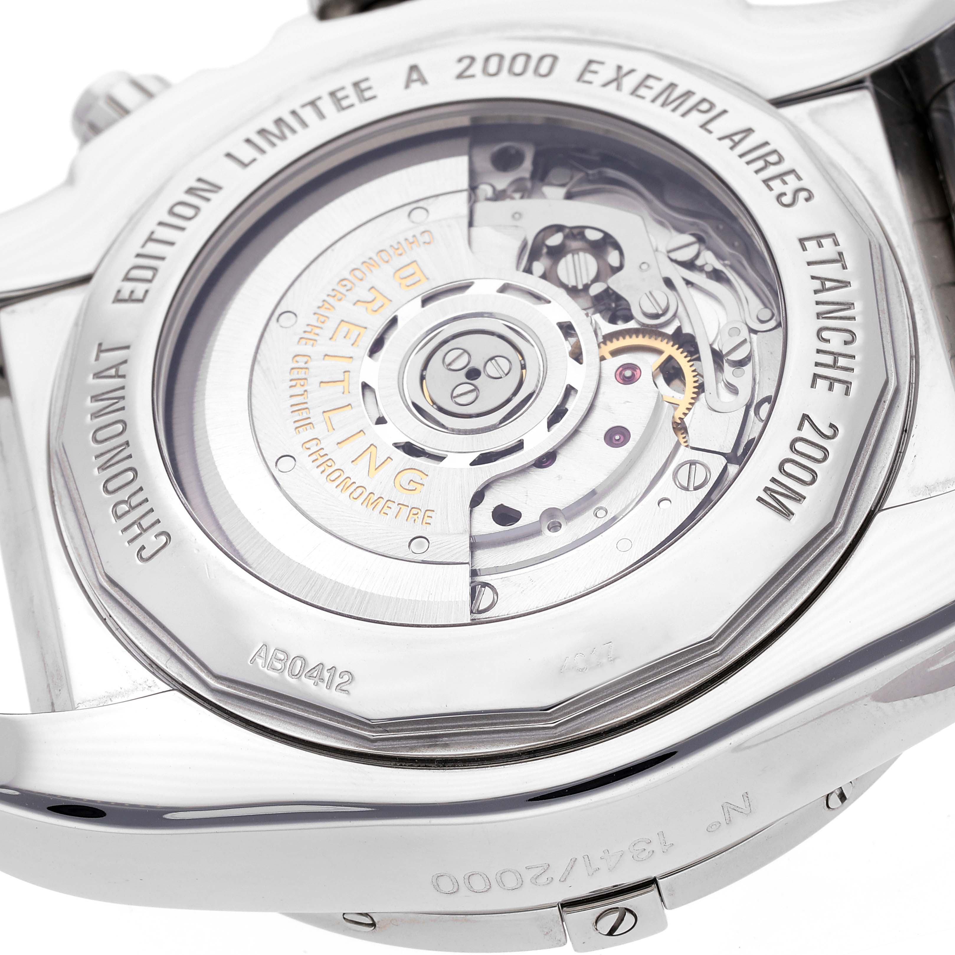 The image shows the back of the Breitling Chronomat AB041210/BB48 - 384A Men's Stainless Steel Black Dial AB041210/BB48 - 384A Men's Stainless Steel Black Dial watch, highlighting its intricate movement and limited edition engraving.