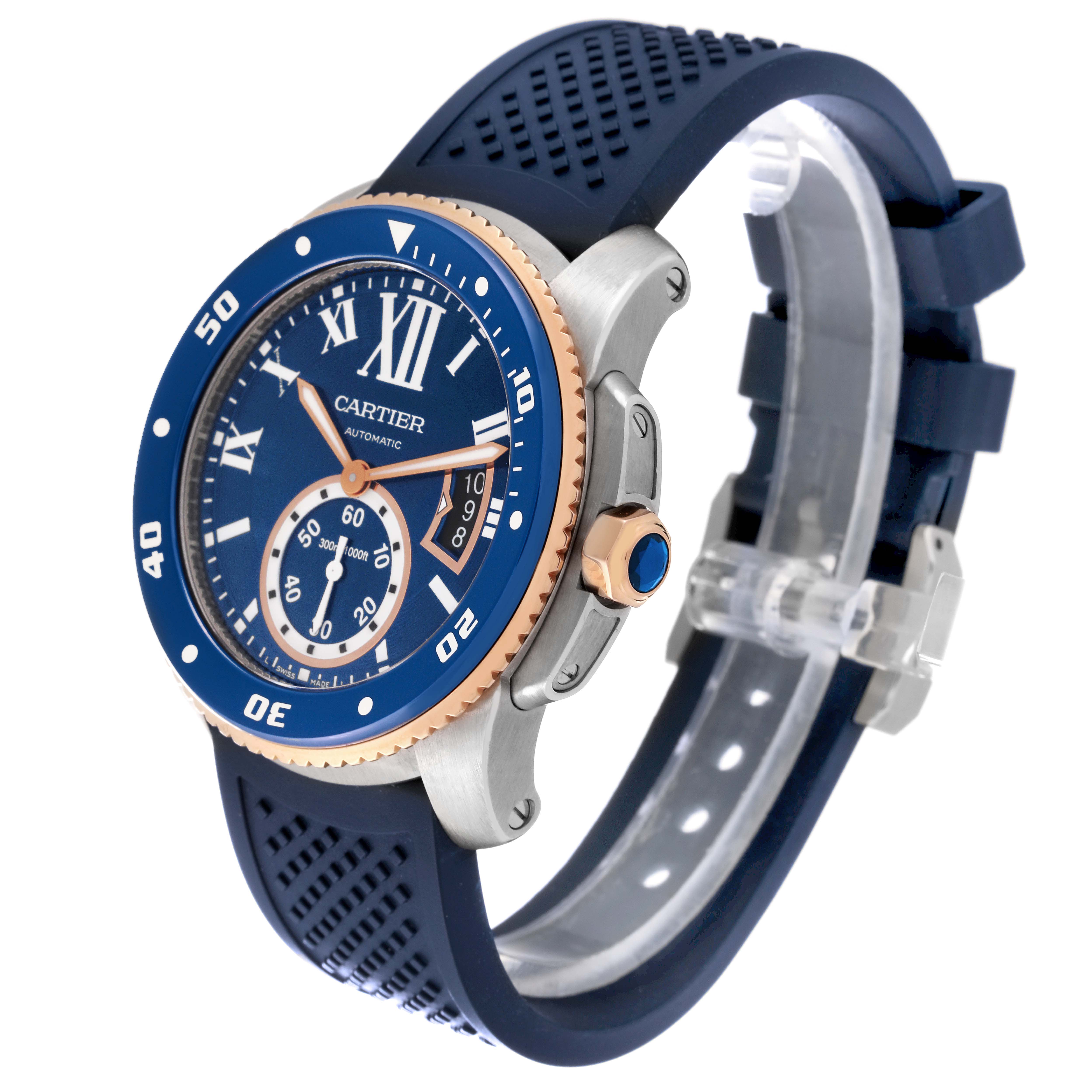 The image shows a side angle of the Calibre de Cartier model by Cartier, highlighting its blue dial, bezel, and rubber strap.