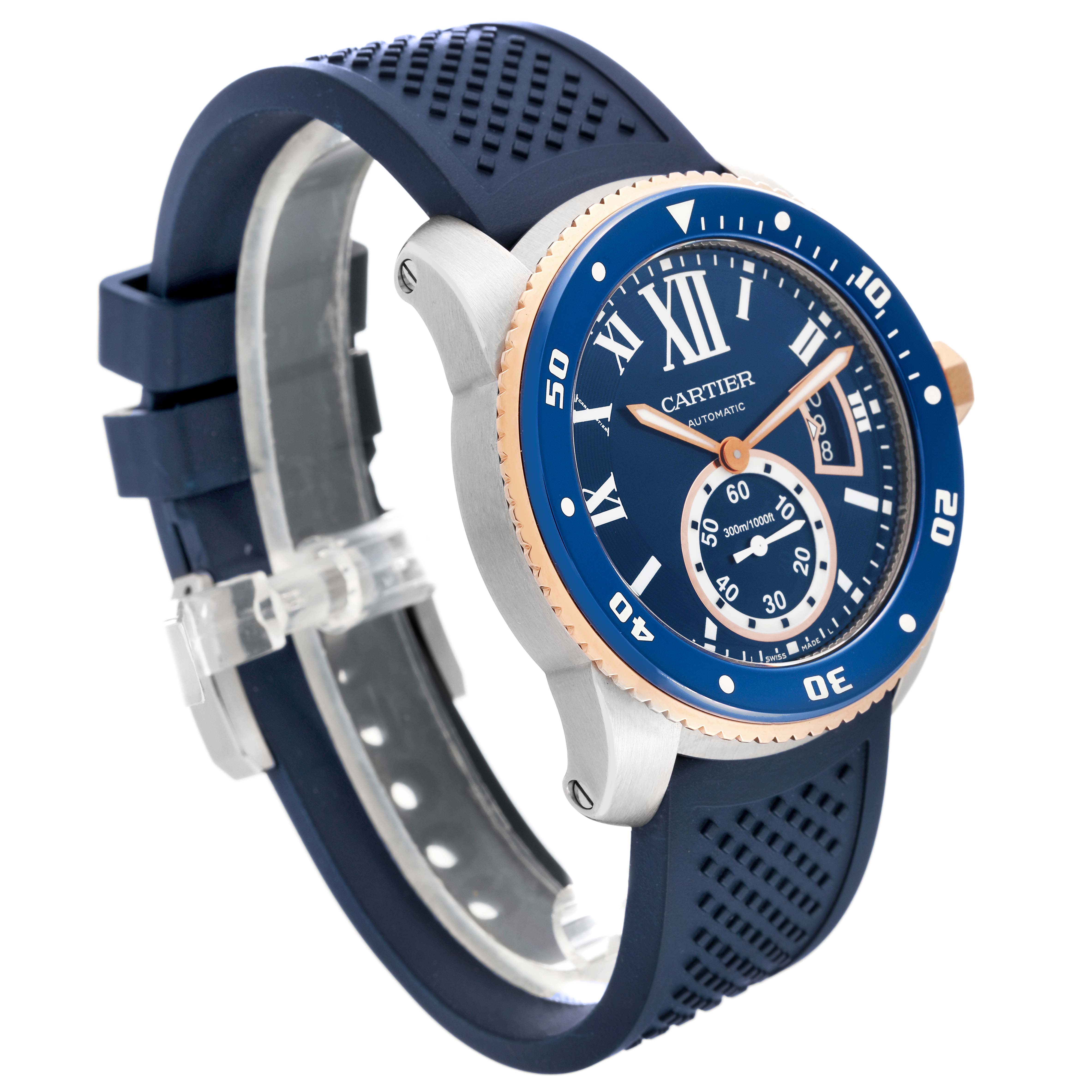 The image shows a side-angle view of the Calibre de Cartier watch by Cartier, highlighting its blue dial, bezel, and rubber strap.