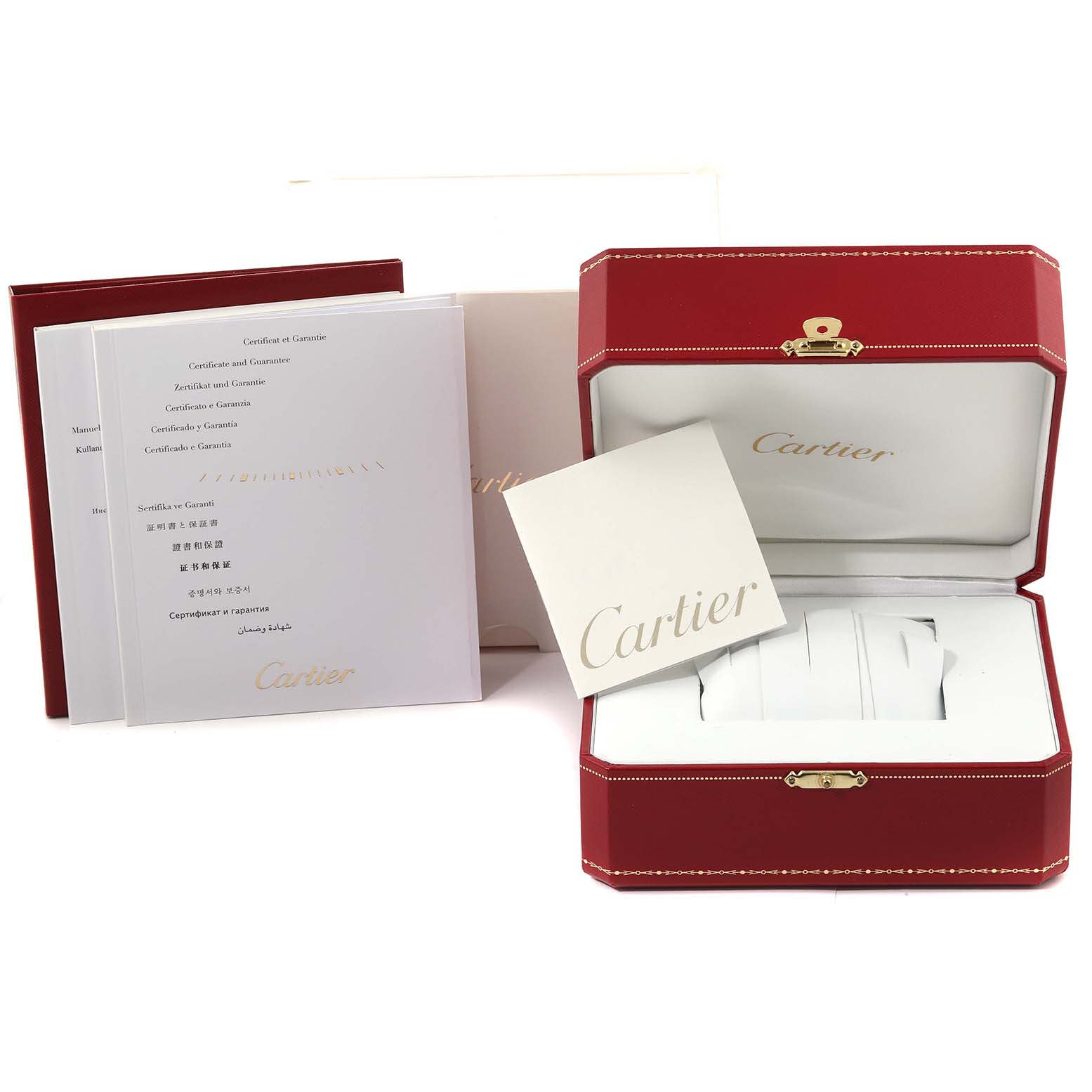 The image shows the packaging, manuals, and guarantee documents for a Calibre de Cartier watch by Cartier.