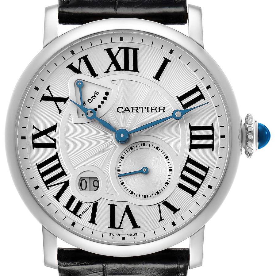 The Cartier Rotonde model W1556202 is shown from a frontal angle, highlighting its Roman numeral dial, blue hands, sub-dial, and crown with a blue cabochon.