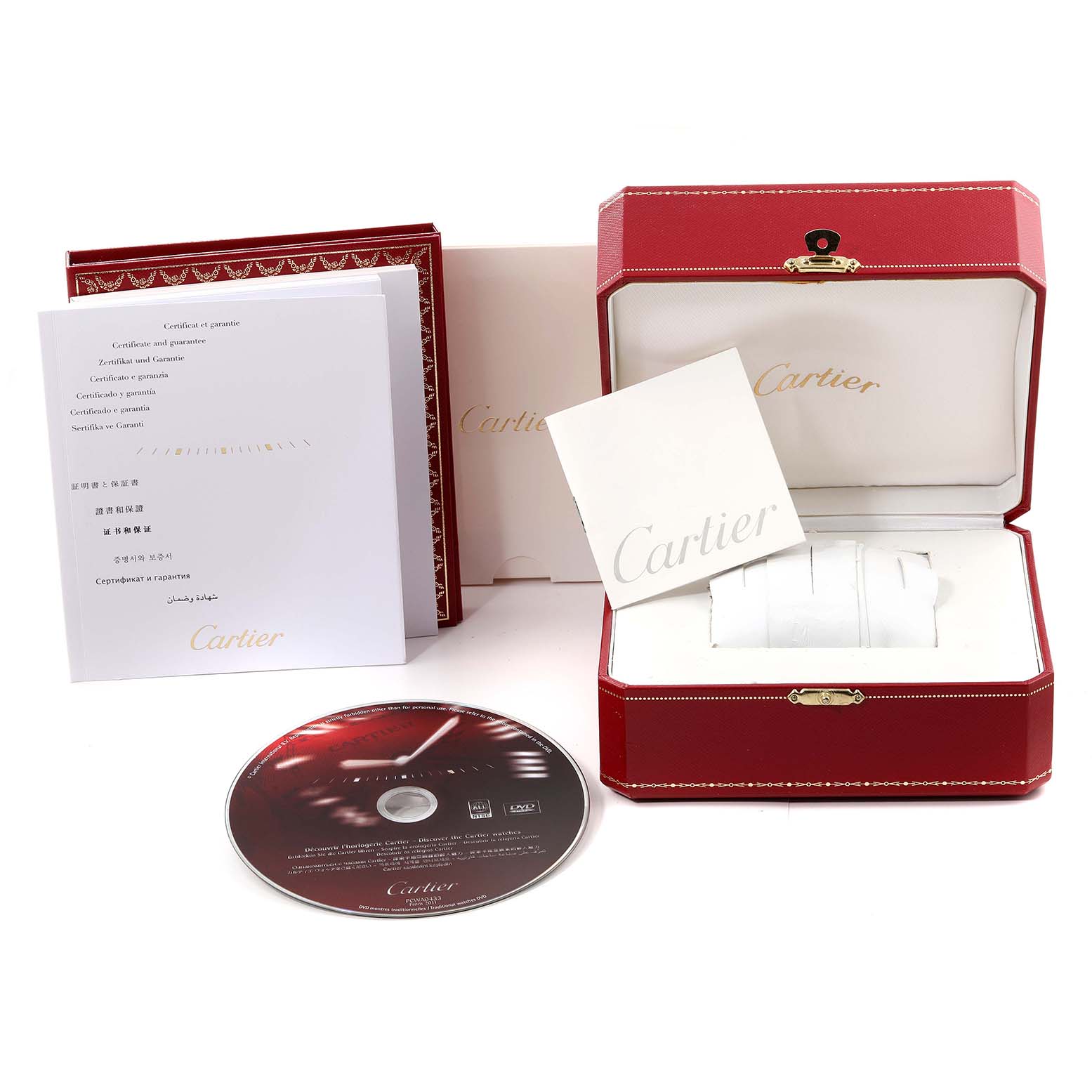 The image shows the packaging, certificate, manual, and a CD for the Santos model by Cartier, along with the red storage box.