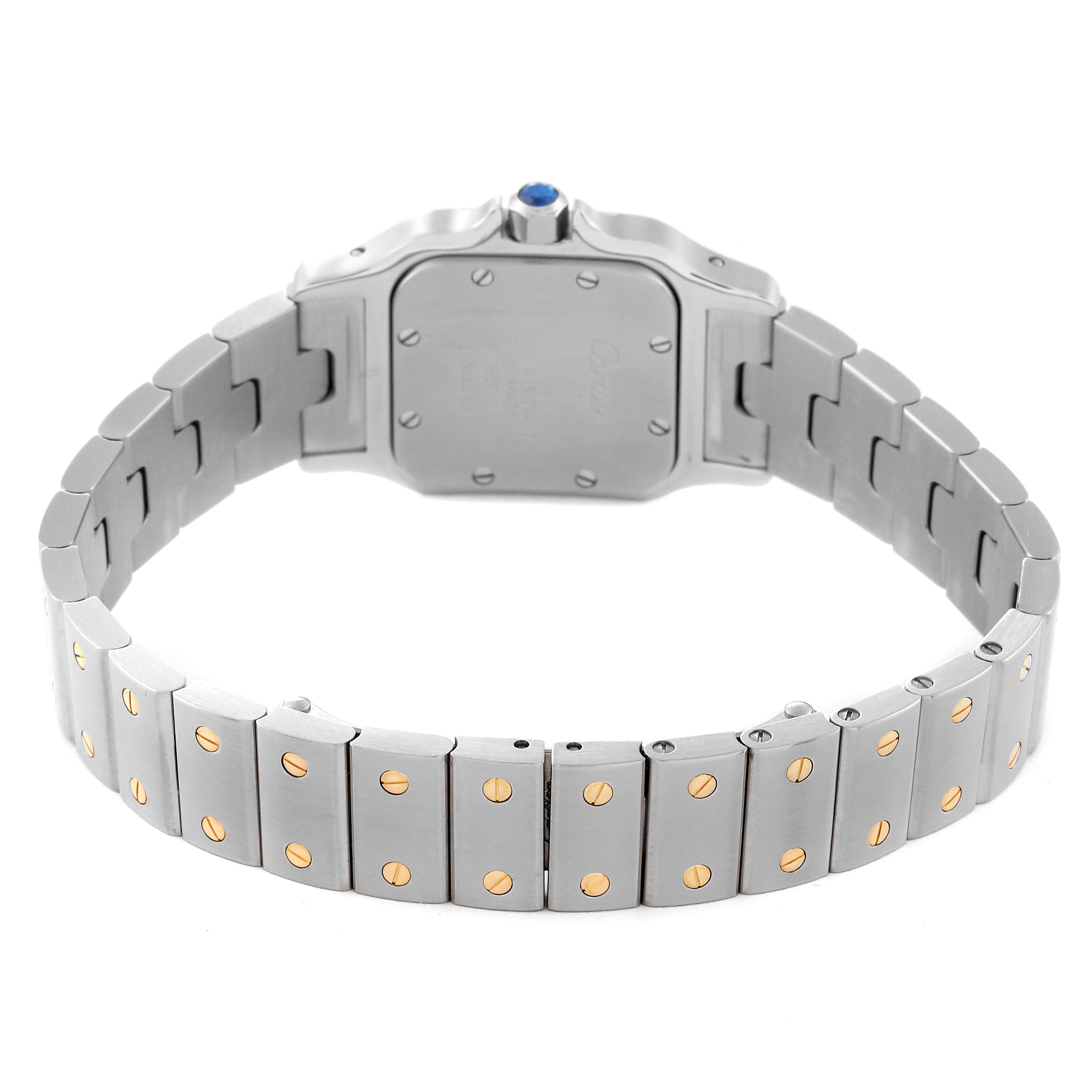 The image shows the back and bracelet of a Cartier Santos W20012C4 Women's Steel and Gold (two tone) White Dial W20012C4 Women's Steel and Gold (two tone) White Dial watch, highlighting its screws and metal band.
