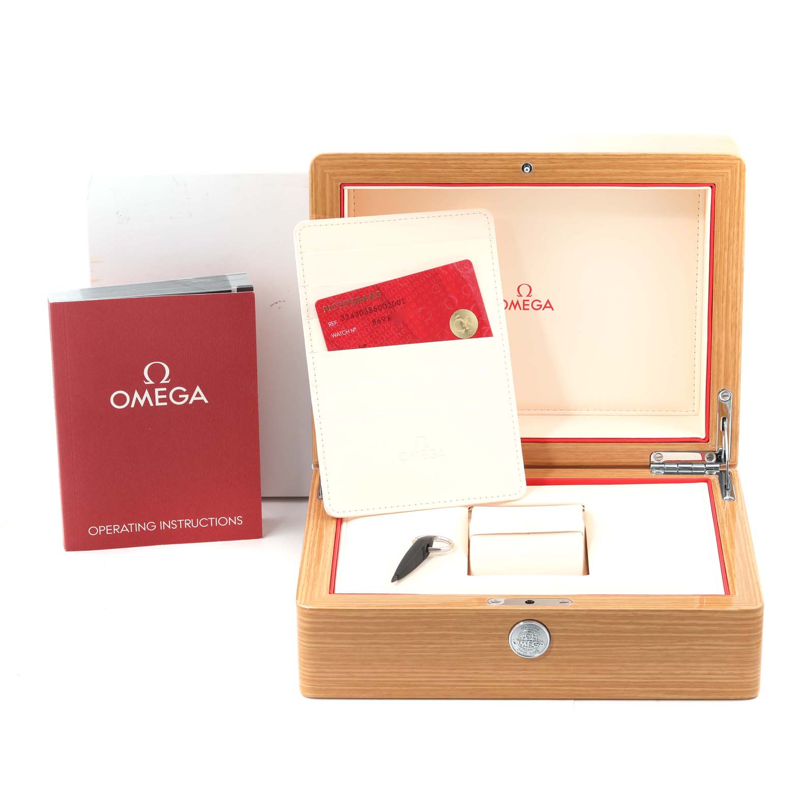 The image shows an Omega Speedmaster 324.30.38.50.02.001 Men's Stainless Steel Silver Dial 324.30.38.50.02.001 Men's Stainless Steel Silver Dial watch box, an instruction booklet, and a cardholder with an authenticity card.