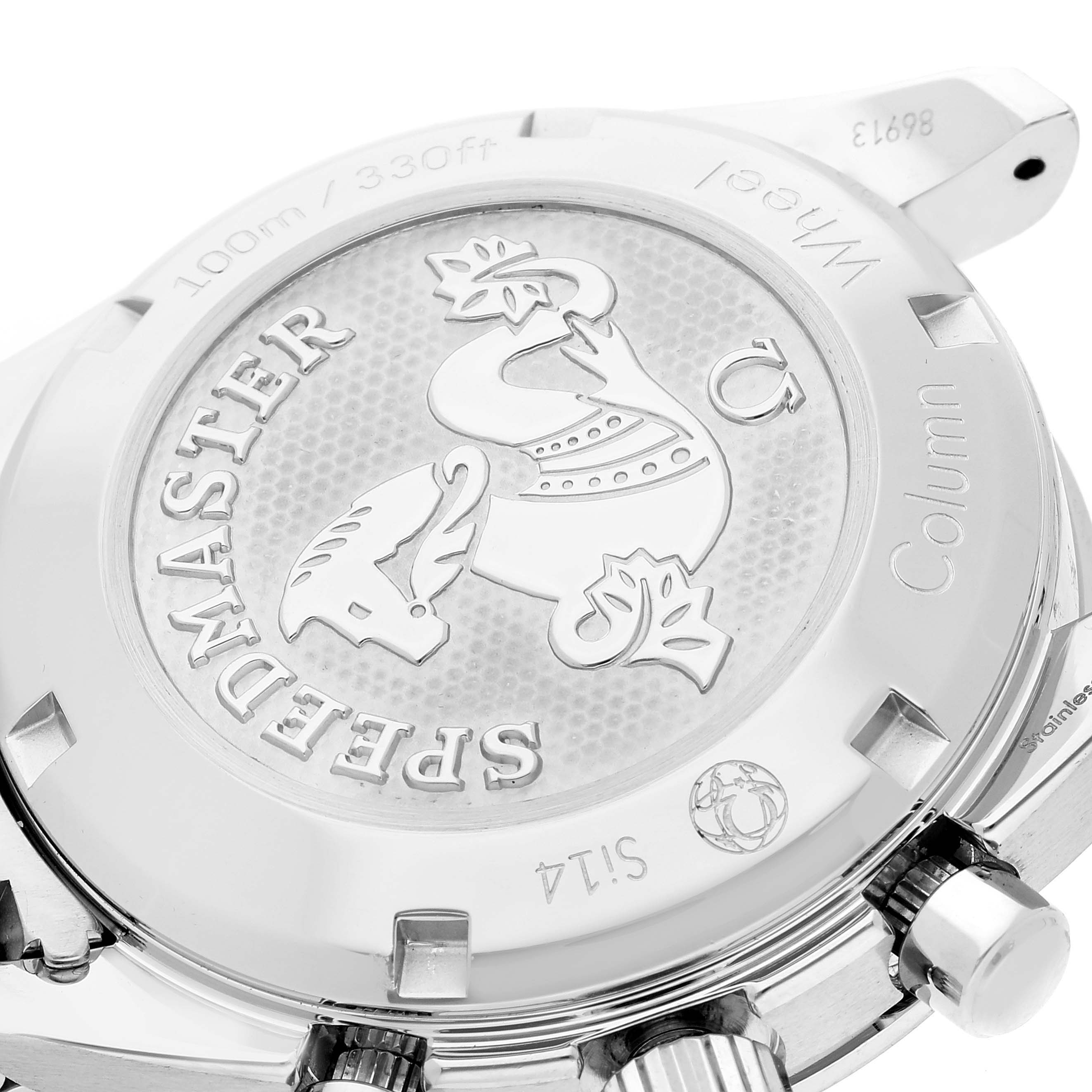 The image shows a close-up of the case back and crown of an Omega Speedmaster 324.30.38.50.02.001 Men's Stainless Steel Silver Dial 324.30.38.50.02.001 Men's Stainless Steel Silver Dial watch, featuring an engraved emblem and text.