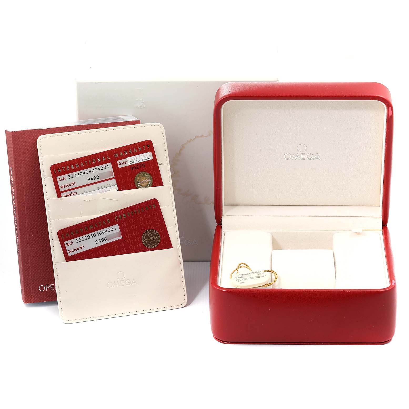This image shows the Omega Speedmaster 323.30.40.40.04.001 Men's Stainless Steel White Dial 323.30.40.40.04.001 Men's Stainless Steel White Dial's watch box, warranty cards, and operating instructions.