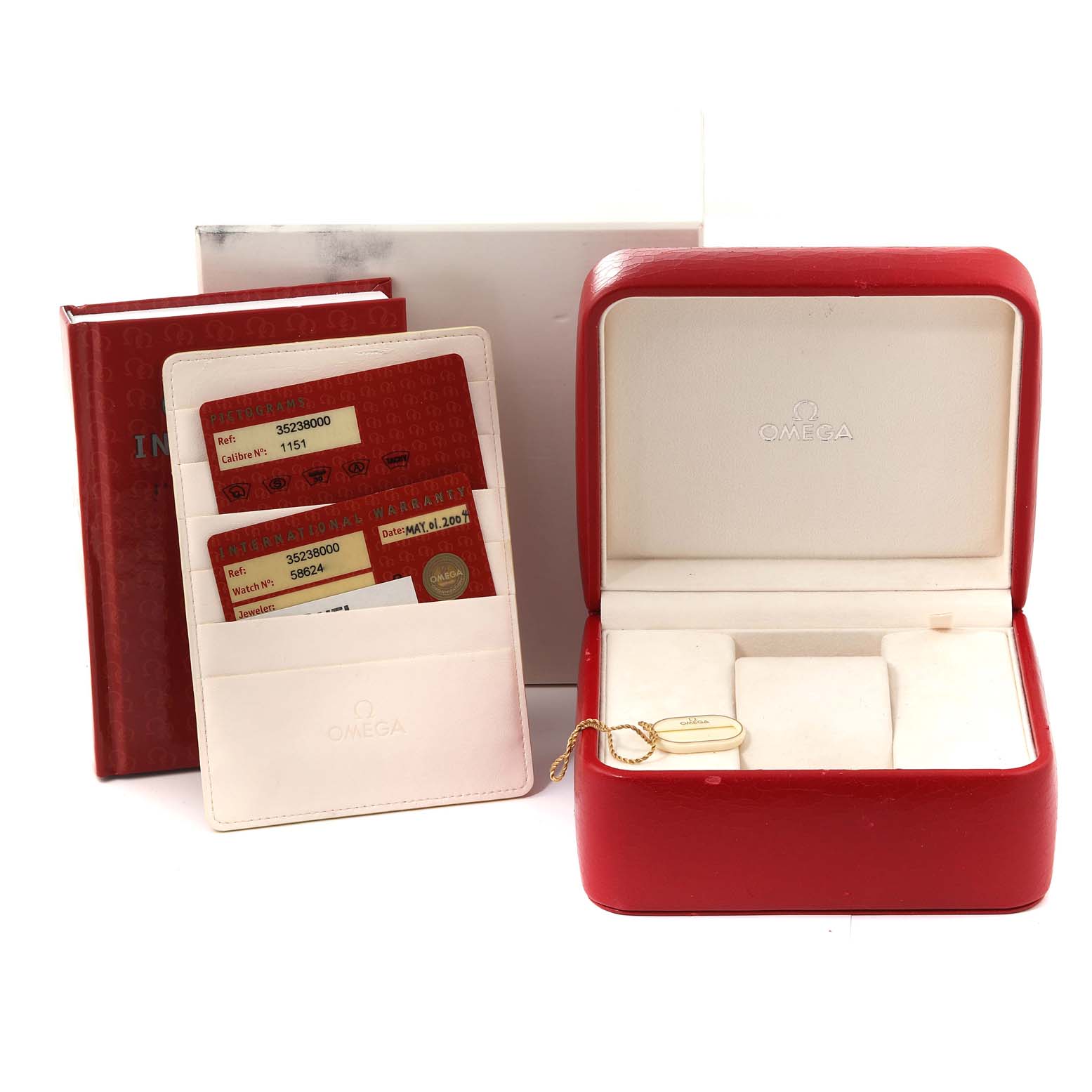 The image shows the packaging and accessories of an Omega Speedmaster 3523.80.00 Men
s Stainless Steel Blue Dial 3523.80.00 Men
s Stainless Steel Blue Dial watch, including the box, warranty cards, and instruction booklet.