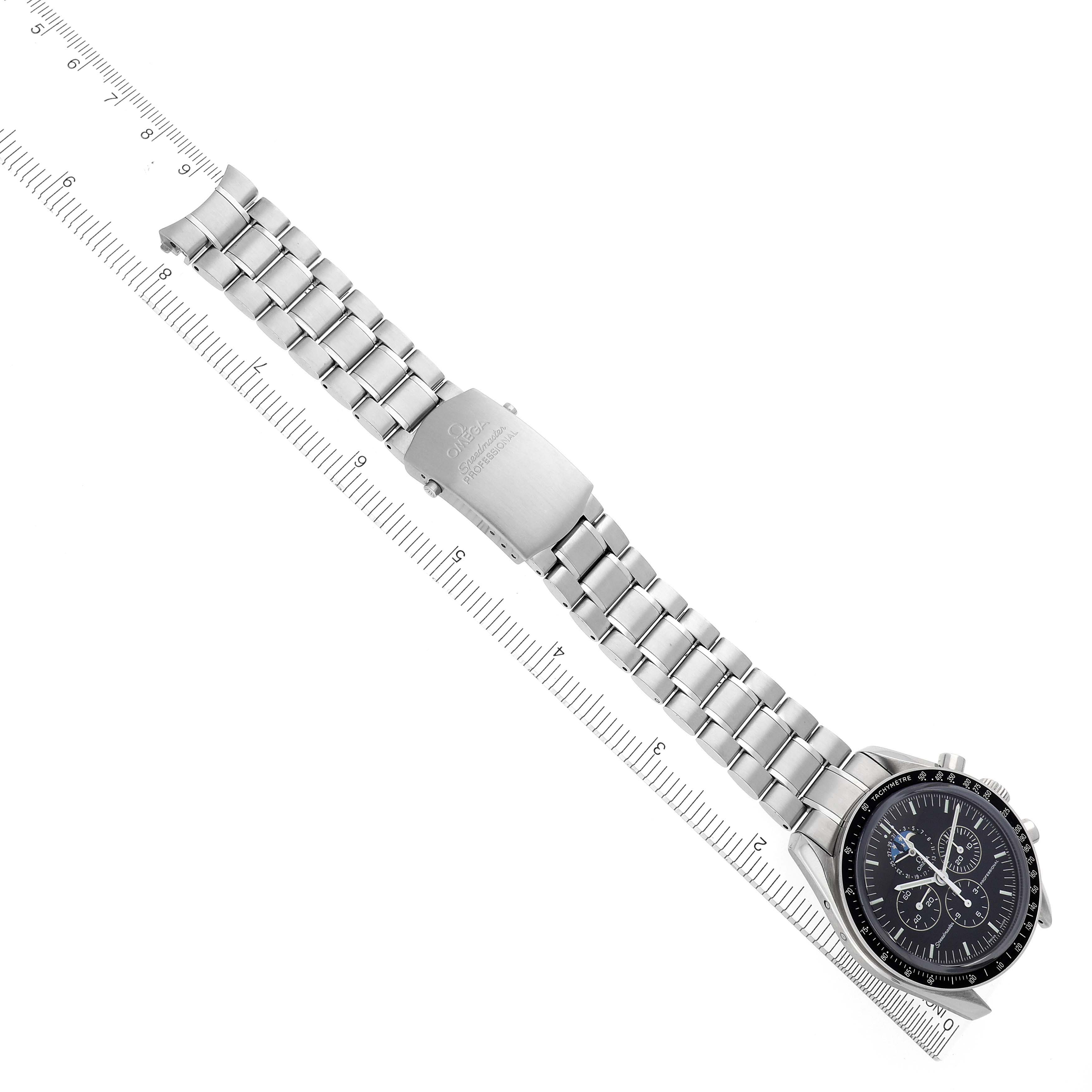The Omega Speedmaster model 3576.50.00 watch is shown from an overhead angle, displaying its full stainless steel bracelet and the face with chronograph features.