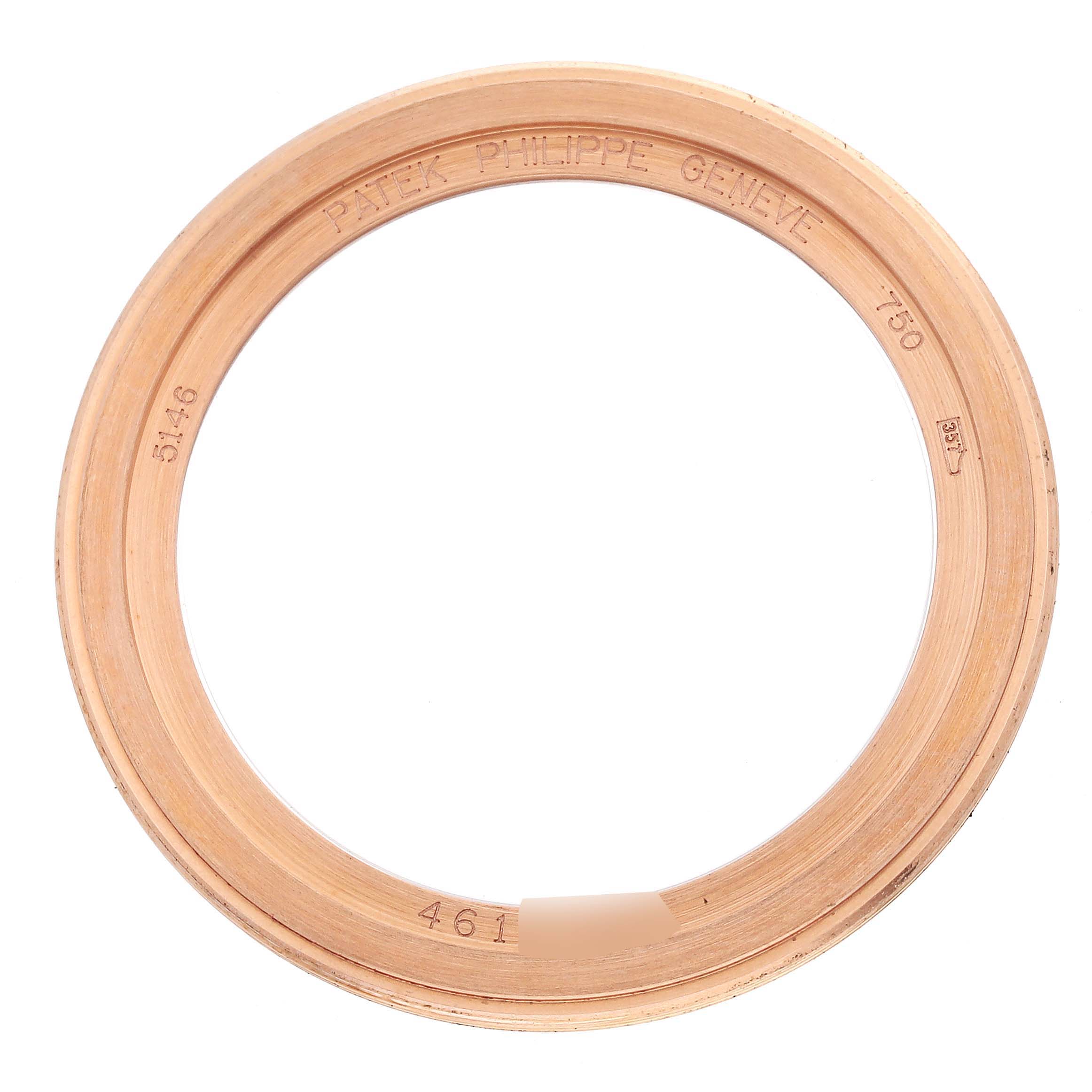 This image shows the bezel or an outer ring part of a Patek Philippe Complications 5146R-001 Men's Rose Gold White Dial 5146R-001 Men's Rose Gold White Dial watch.